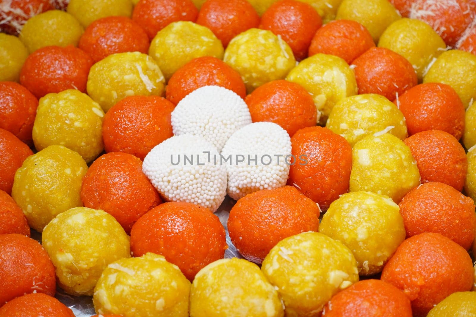 Traditional Indian sweets arranged in vibrant colors for celebration.