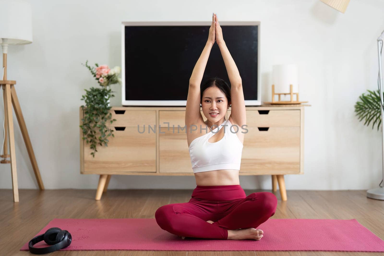 A dedicated yoga practitioner stretches in a serene environment, focusing on flexibility, tranquility, and mindfulness.