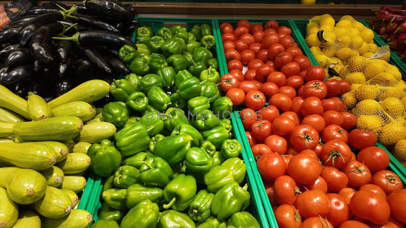 Colorful vegetables arranged in baskets at a local market.