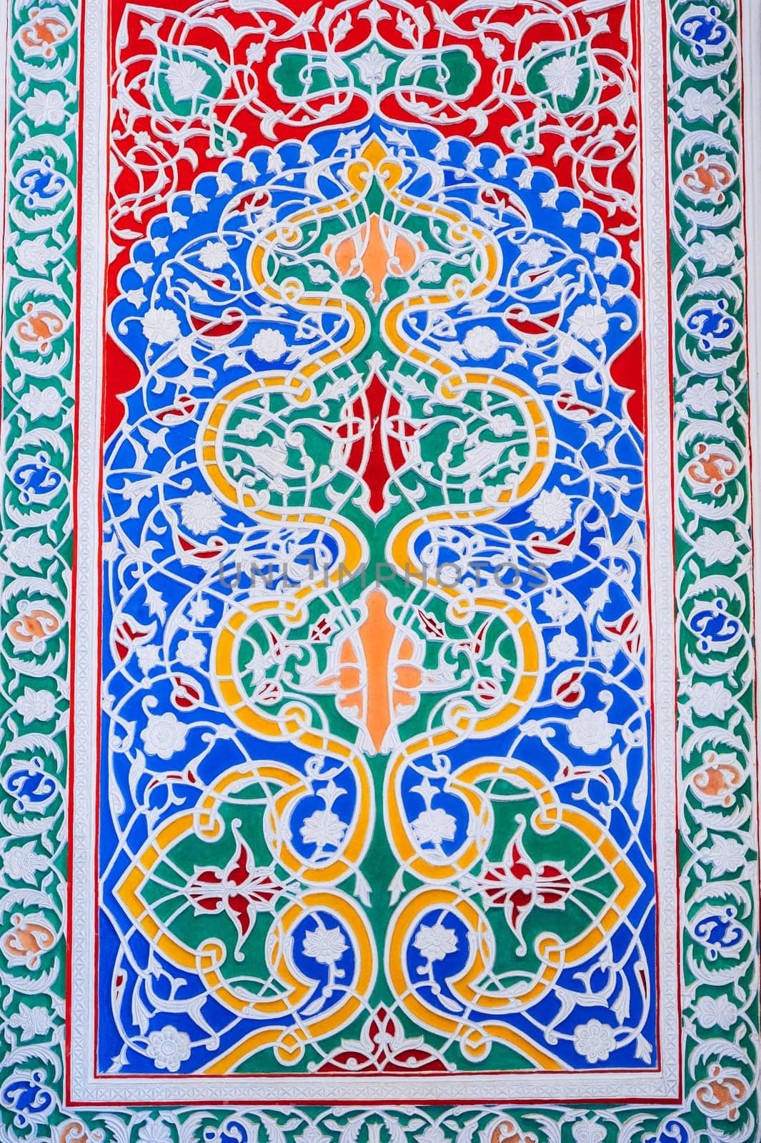 colorful carved wooden painted background with traditional Uzbek ornaments and oriental asian patterns in Tashkent in Uzbekistan