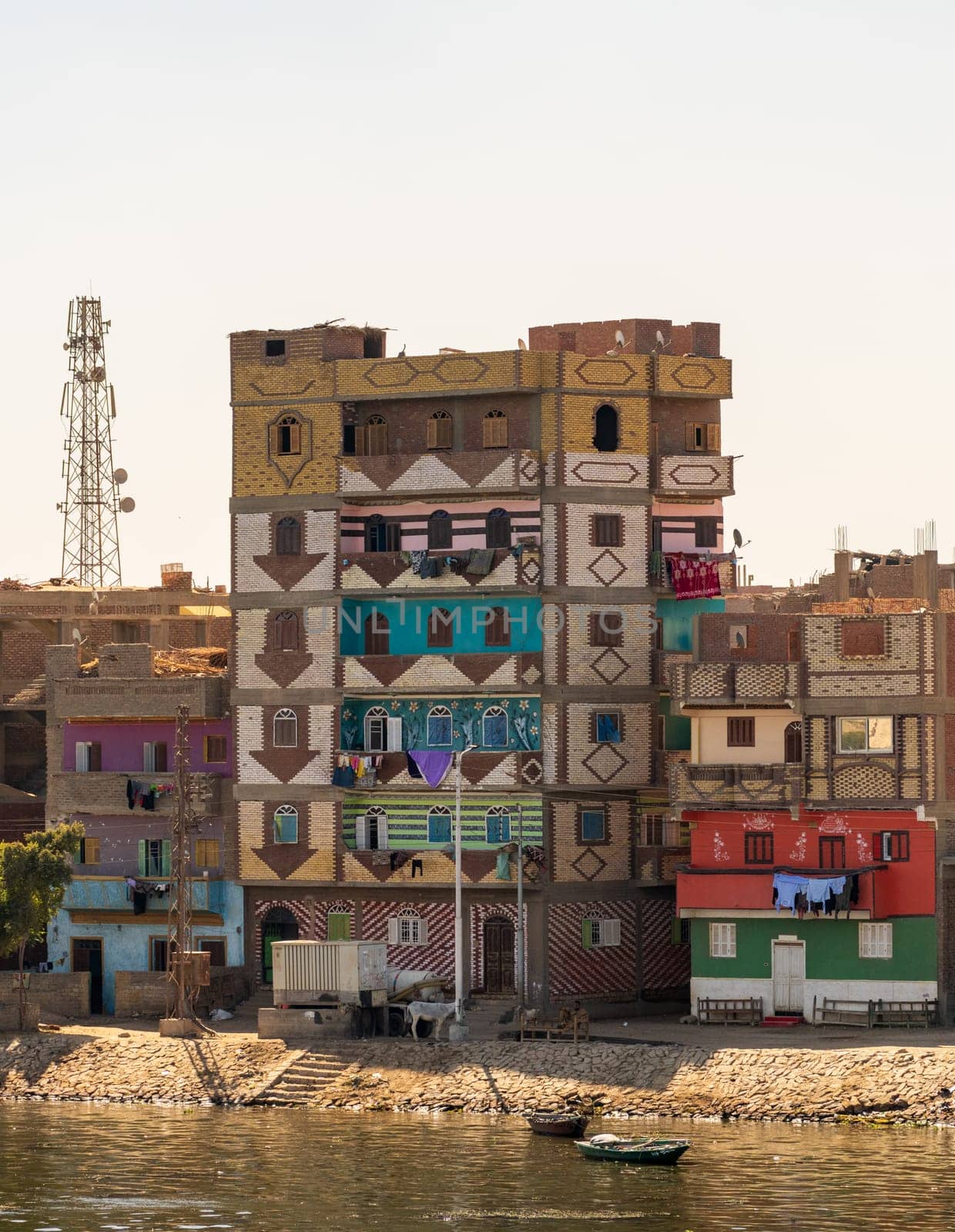Colorful newly constructed apartments and homes by the banks of the Nile in Esna