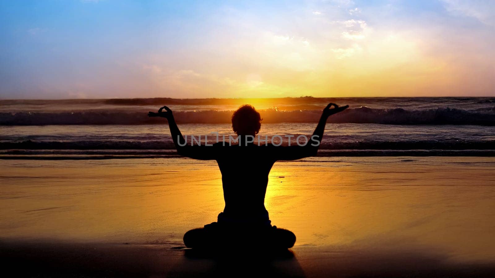 Yoga on the beach at sunset