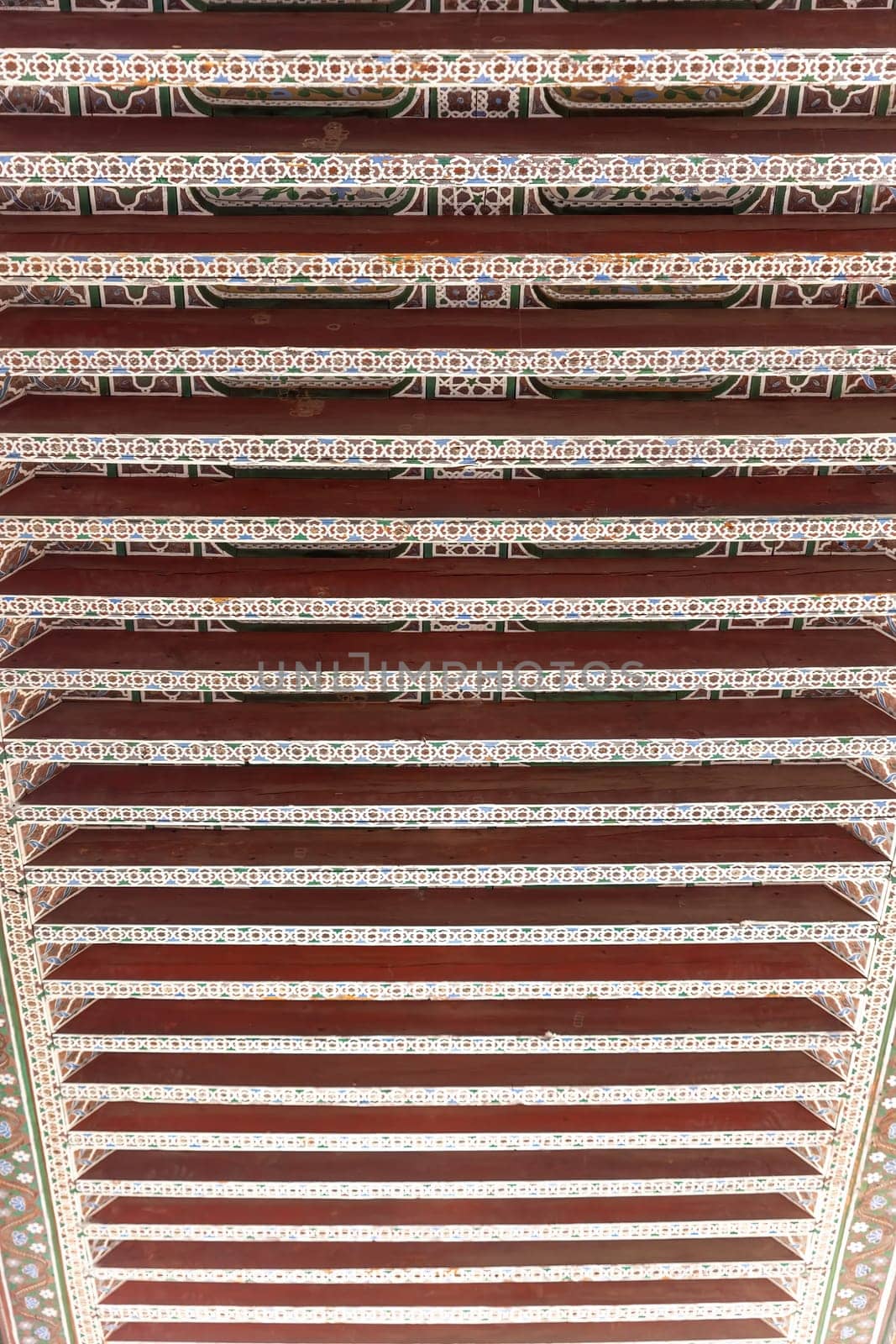 Closeup view of the handcrafted wooden detail at the Bahia Palace at Marrakesh. Morocco. Vertically. 