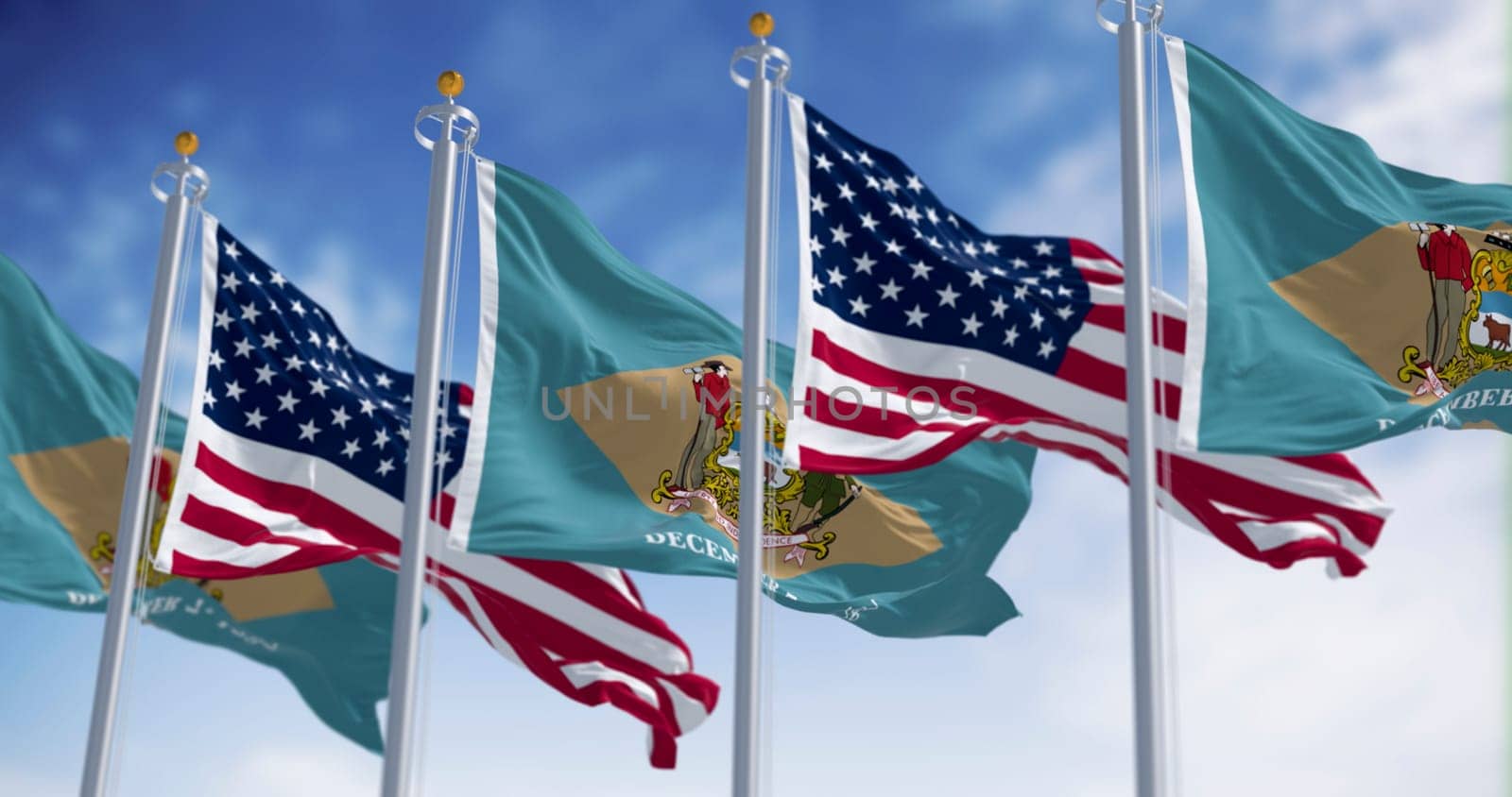 The flags of Delaware and the United States wave together in the wind. Buff diamond with historic coat of arms and its 1787 ratification date. 3d illustration render. Rippled fabric