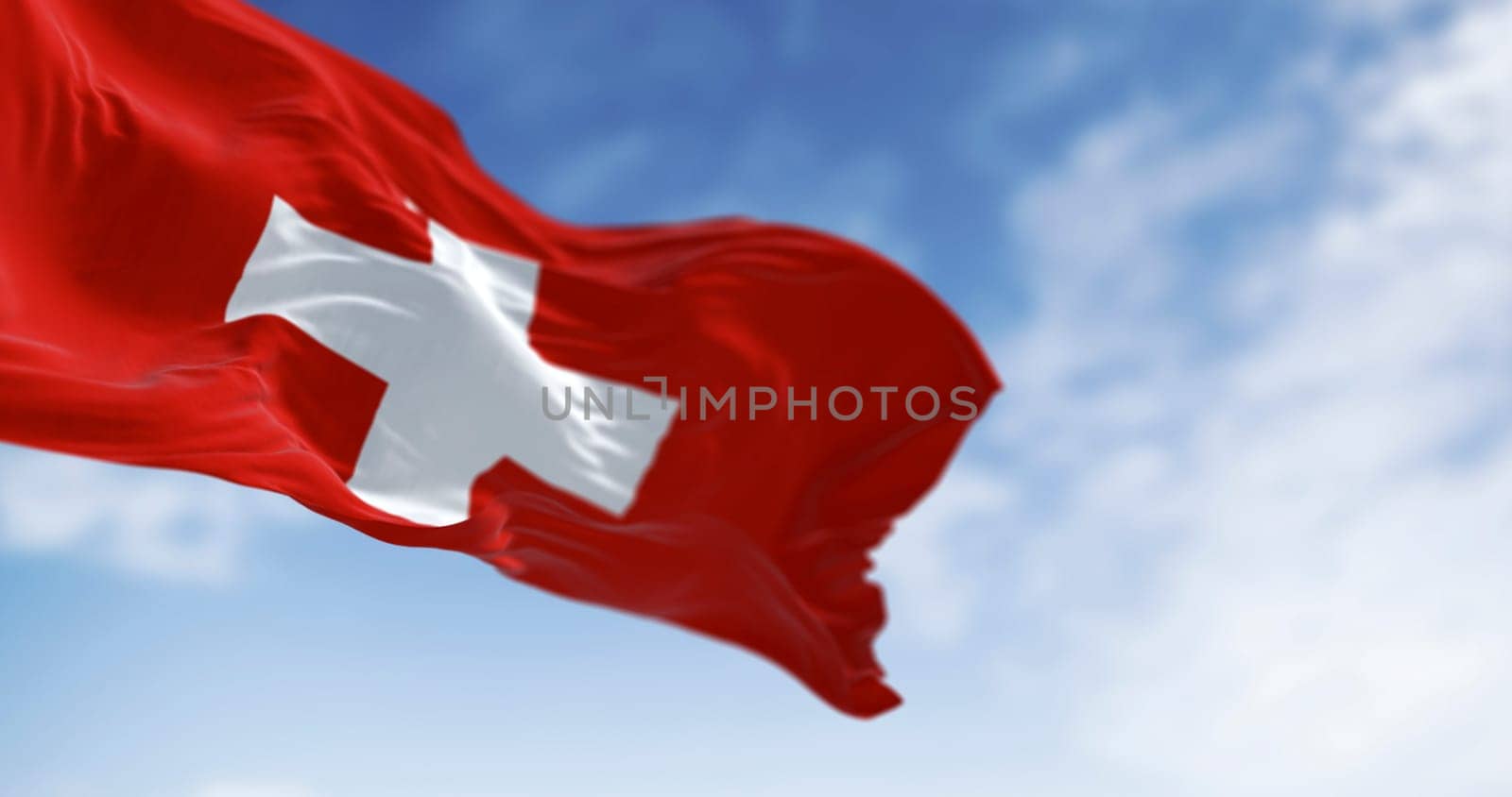 Swiss flag with a bold white cross on red square field, waving in the wind. A centuries-old emblem of neutrality, unity, and Alpine pride. 3d illustration render. Rippled fabric.