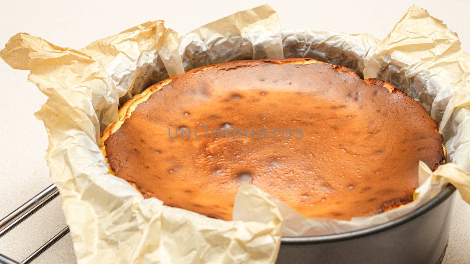 Stunning Top View of a Delicious Homemade Baked Cheesecake with Cracks on White Background.