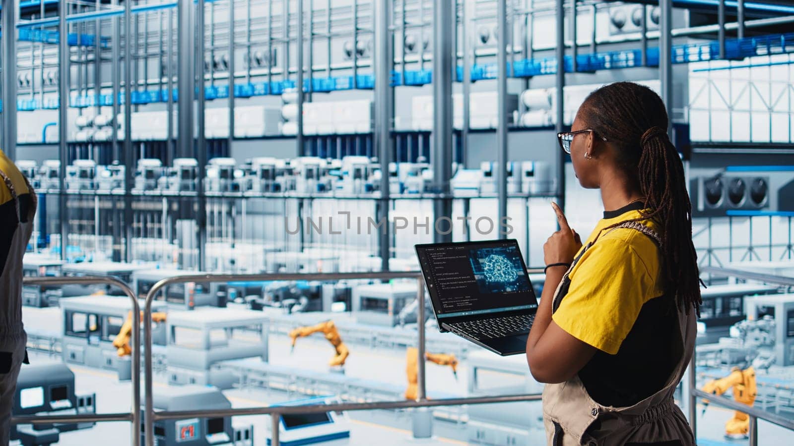 Engineer in smart factory using augmented reality to collect data on laptop. Professional on platform in industry 4.0 industrial plant equipped with sensors using AI technology, camera A
