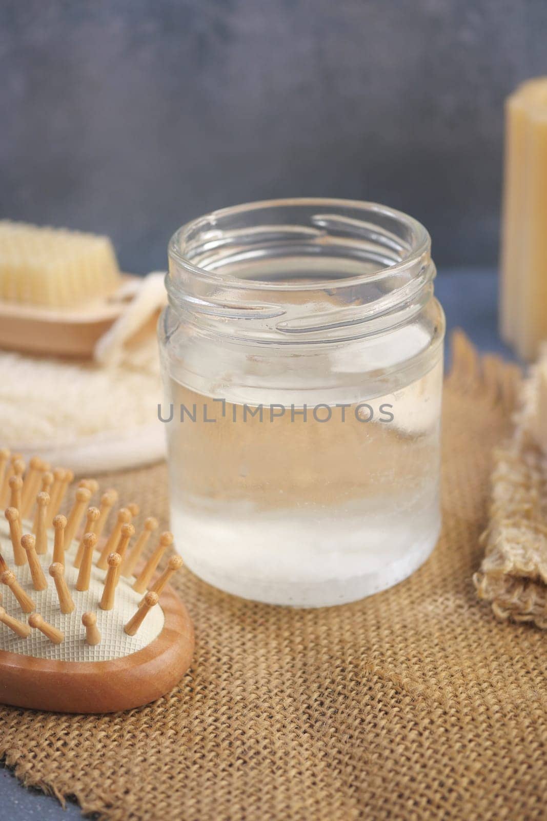 Natural coconut oil displayed on a rustic table setting,