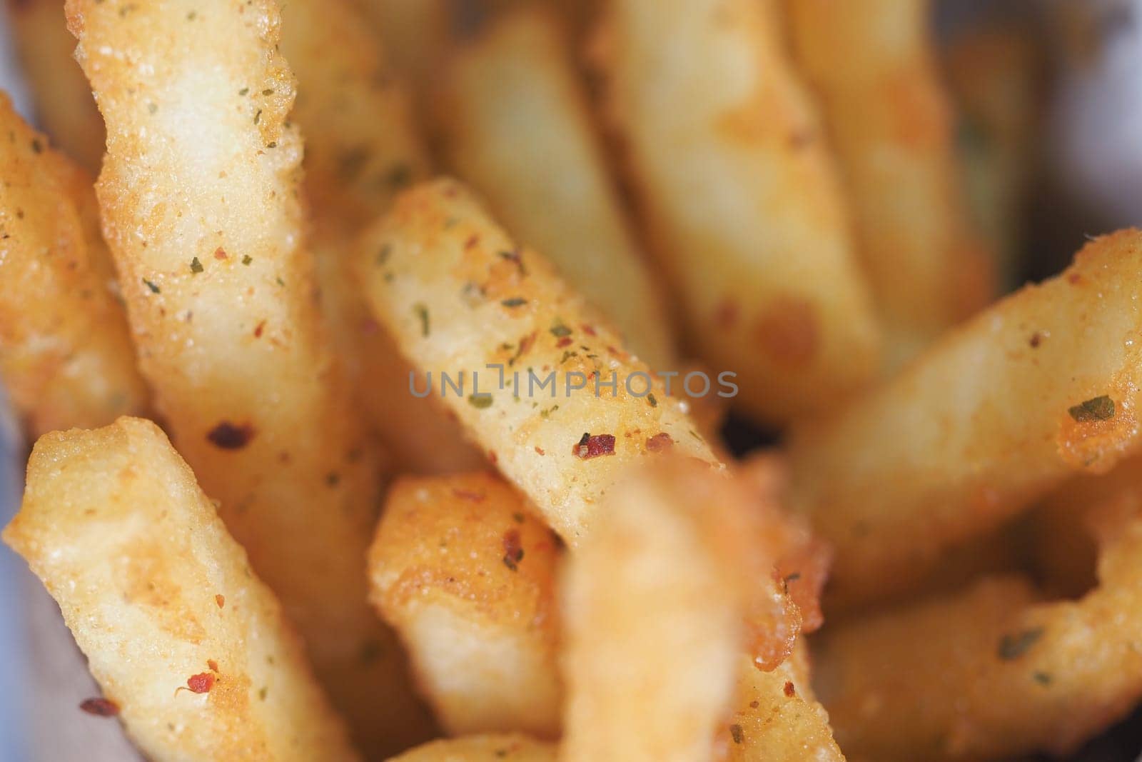 Deliciously fried potato sticks seasoned to perfection and ready to enjoy.
