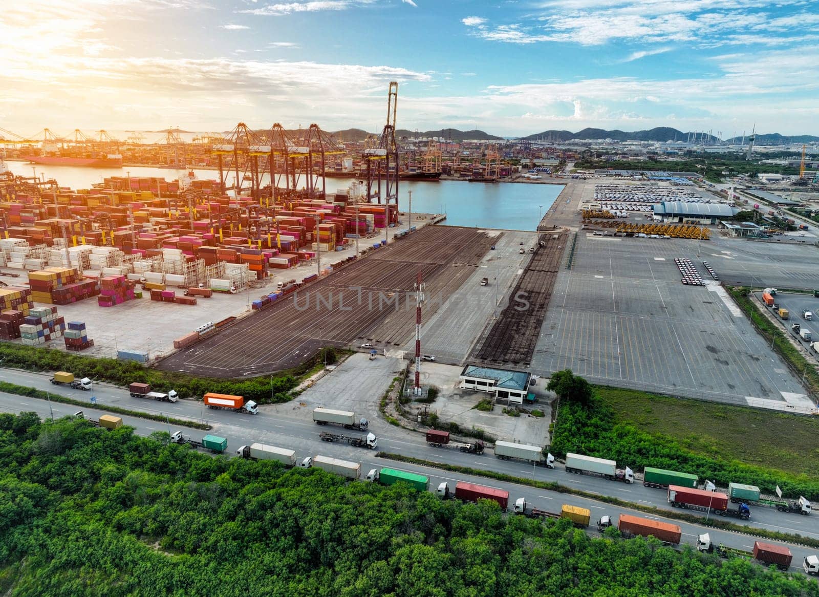 Logistics and transportation of container cargo ship at ship port. Container truck and crane bridge in shipyard. Import export and transport industry. Terminal port for export transport by ship.