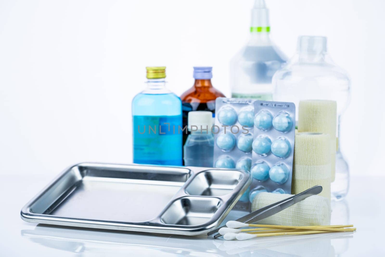 Medical equipment for treating infections. Wound care dressing set. Medical supplies for nurses. Conform bandage, forceps, cotton stick, alcohol. Sterile dressing materials. Healthcare equipment.