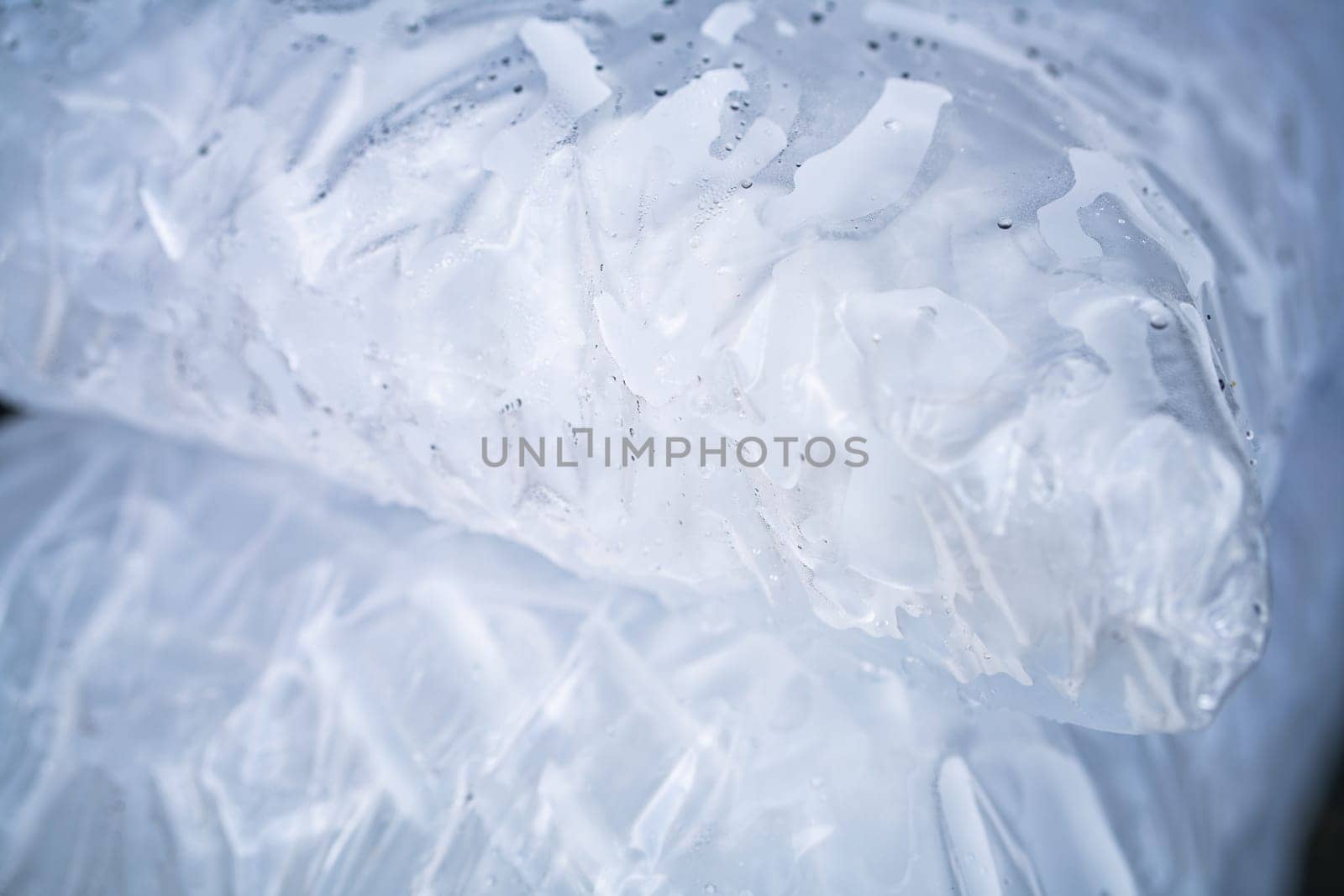 Closeup of tube ice inside a clear plastic bag. Convenient and lightweight packaging designed for easy transportation and storage. Hygiene and freshness for commercial and industrial applications.