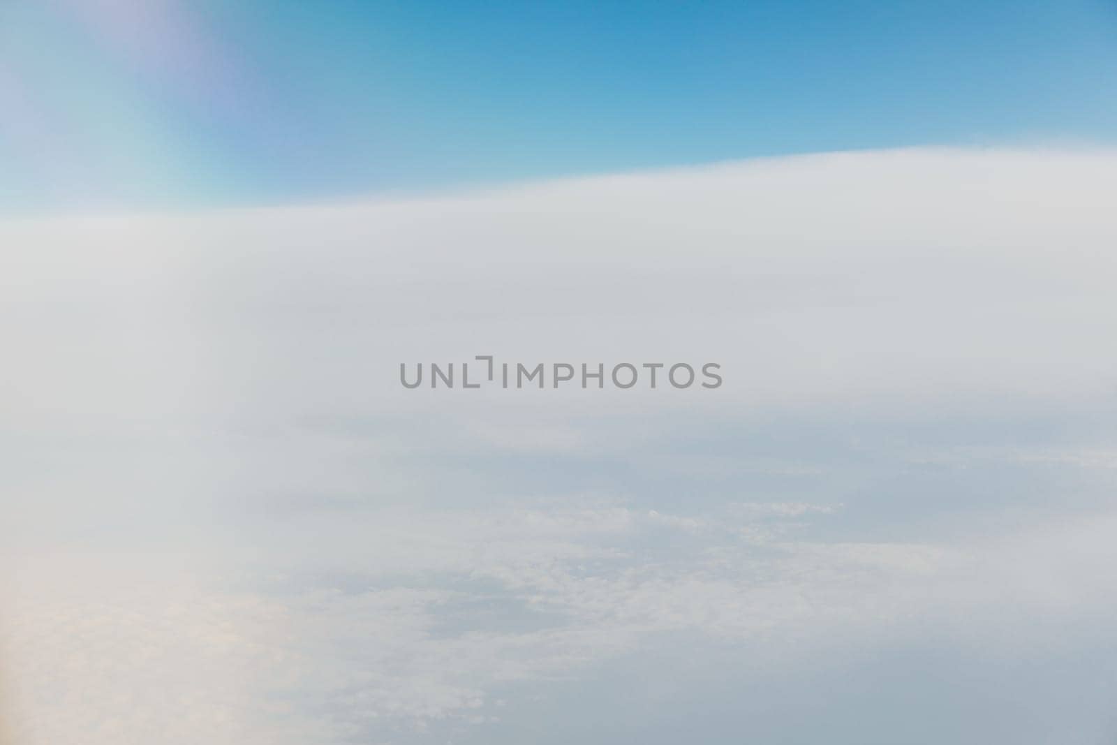 landscape in the sky with clouds from the window of an airplane