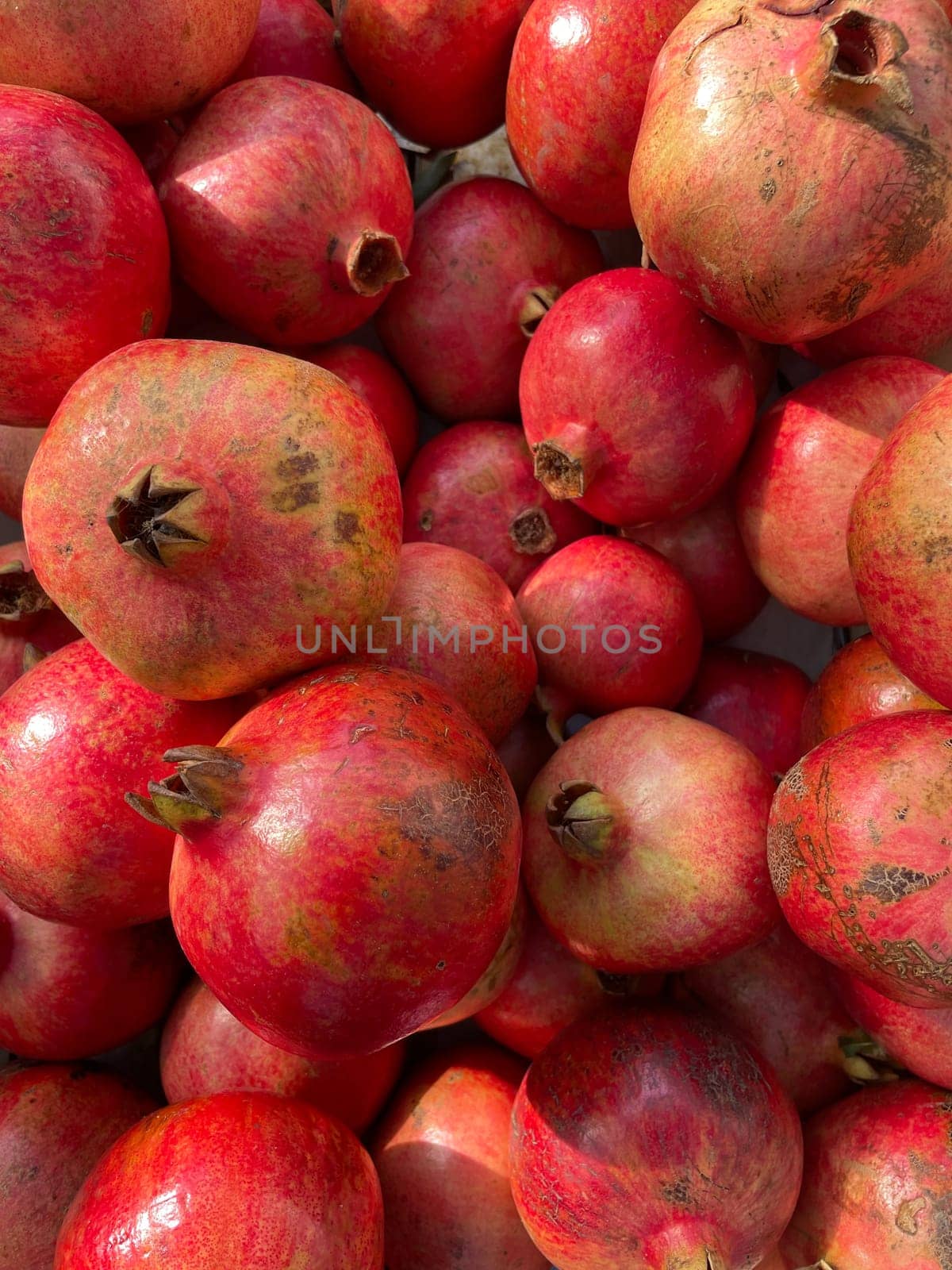 lots of ripe pomegranate fruits for cooking as background