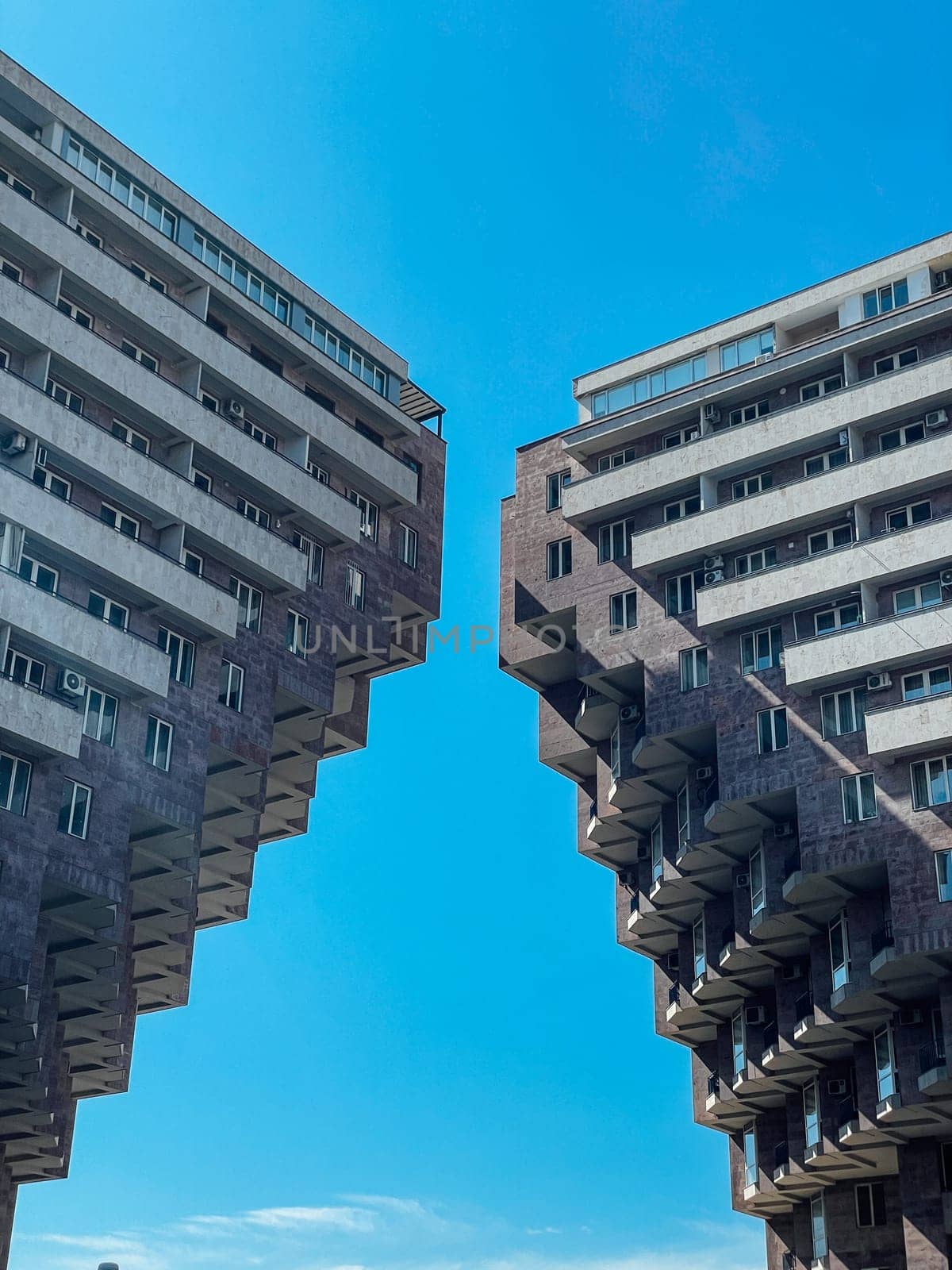 houses standing side by side against a blue sky