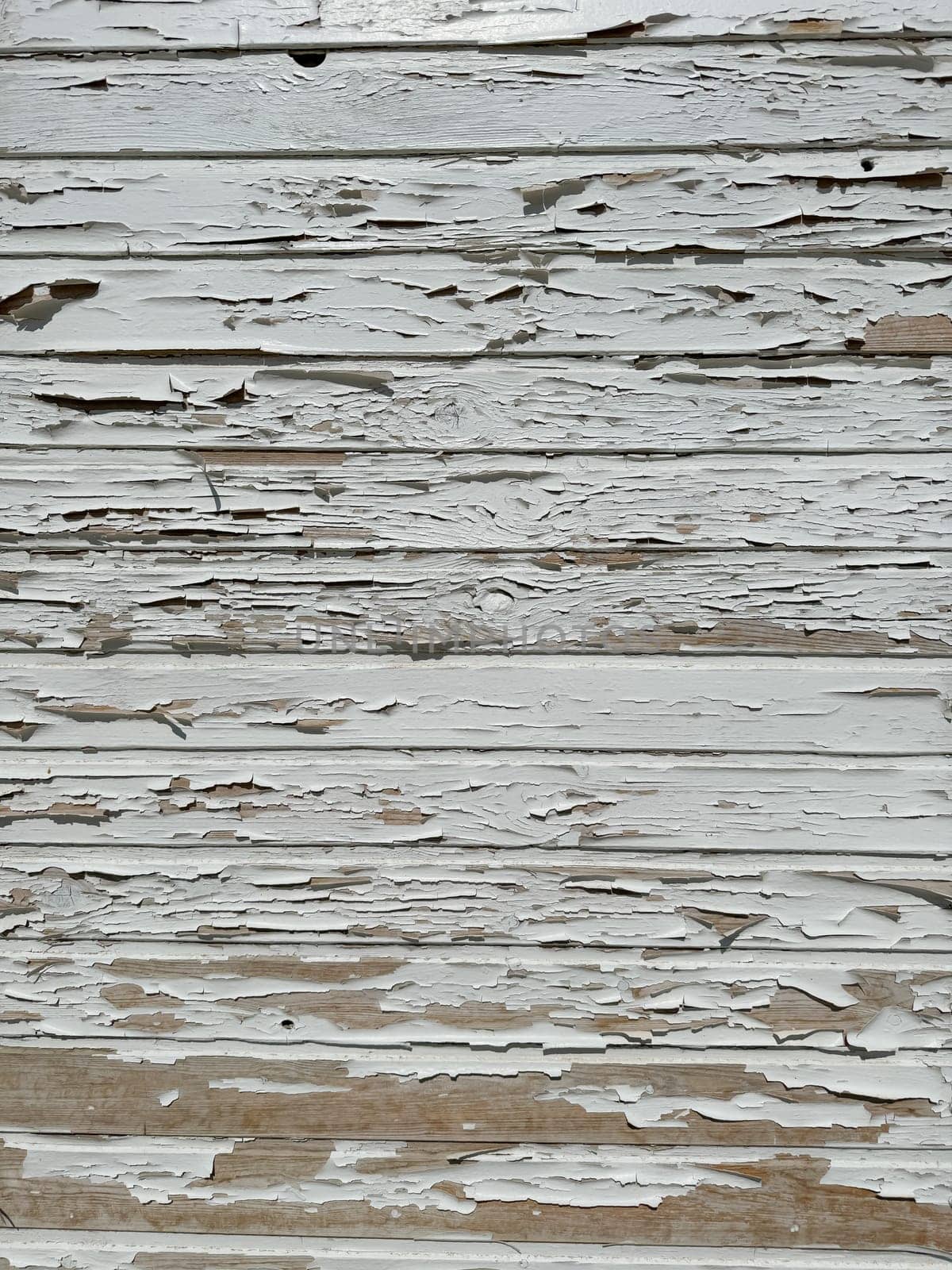 vintage cracked white wooden wall as background
