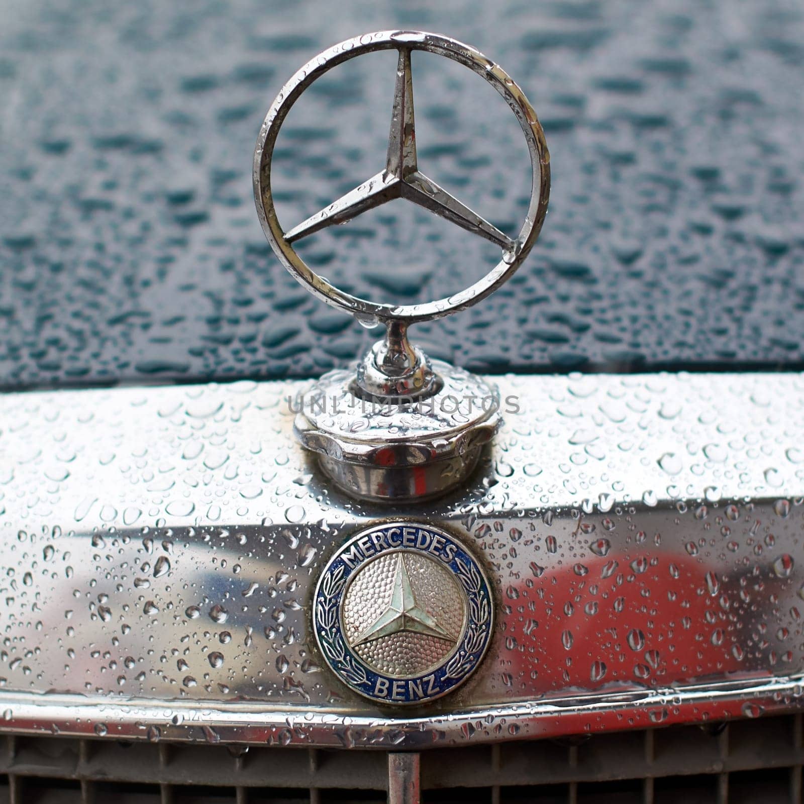 Lviv, Ukraine - Dec 09, 2017: Mercedes-Benz logo on a vintage classic Mercedes-Benz W114 released circa 1970 in Germany