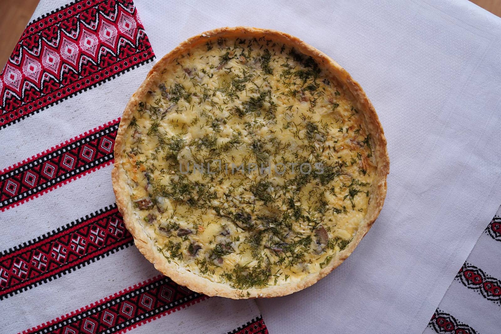 Traditional Ukrainian food on the table with embroidered tablecloth.