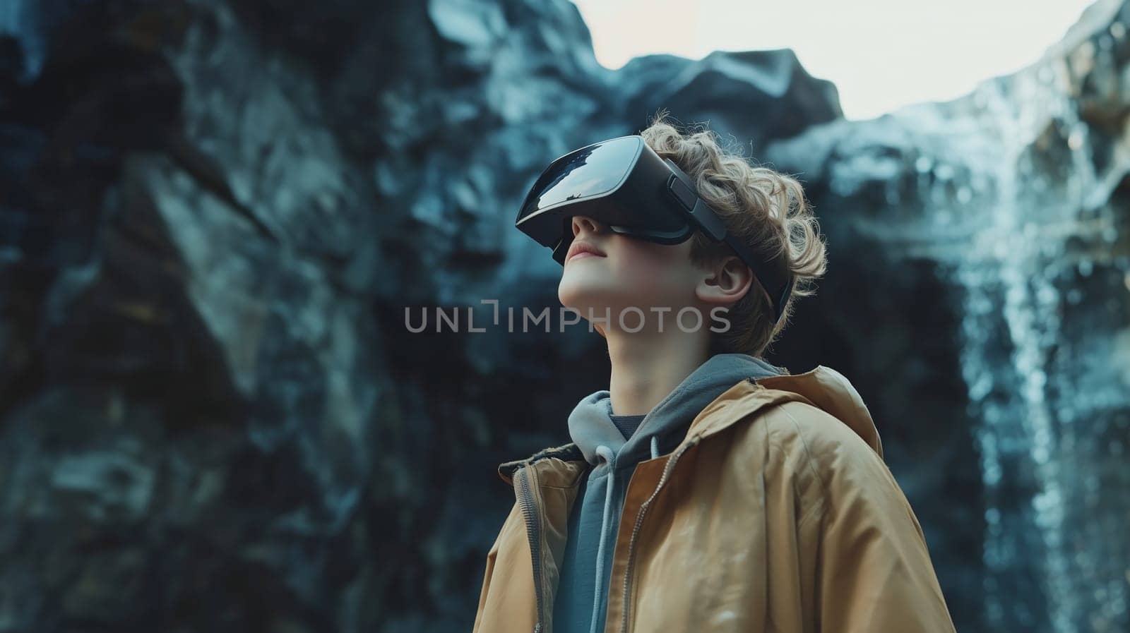 Teenager wearing virtual reality goggles experiencing immersive natural simulation with waterfall backdrop, blending outdoor adventure with digital technology