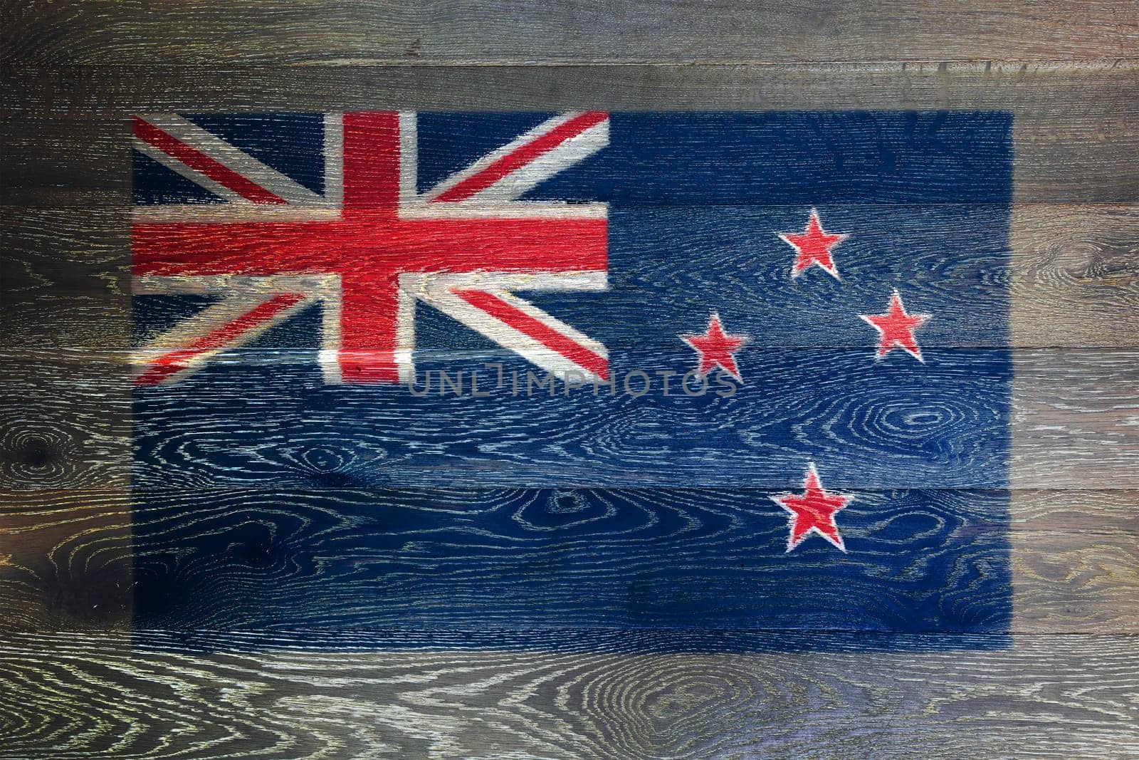 A New Zealand flag on rustic old wood surface background