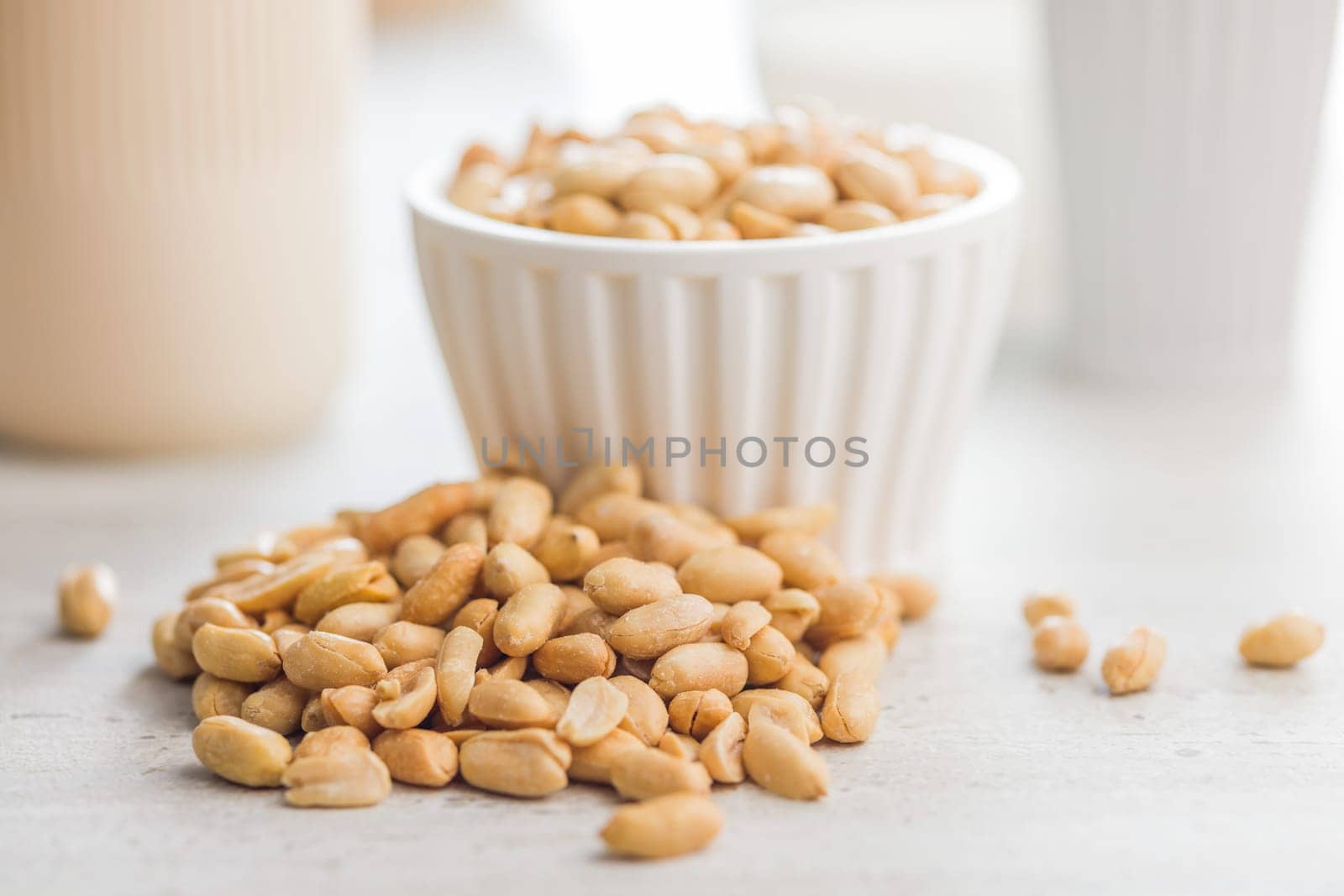 Roasted salted peanuts on a kitchen table.