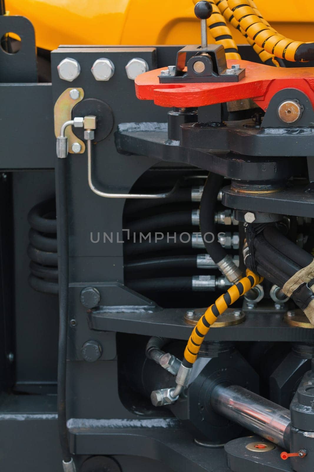 Part of tractor - mechanism of the bucket scraper, close up