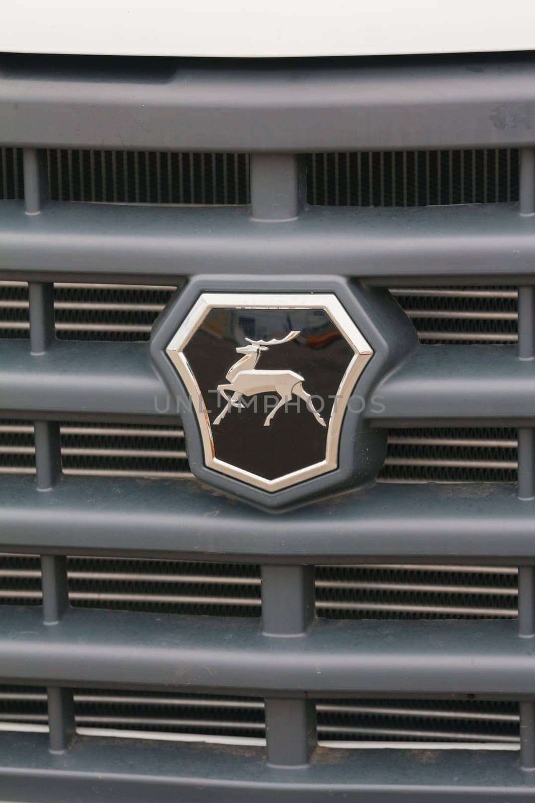 Kazan, Russia - October 28, 2017: Trademark logo deer on the hood of the small truck Gazel - Russian automotive industry, close up
