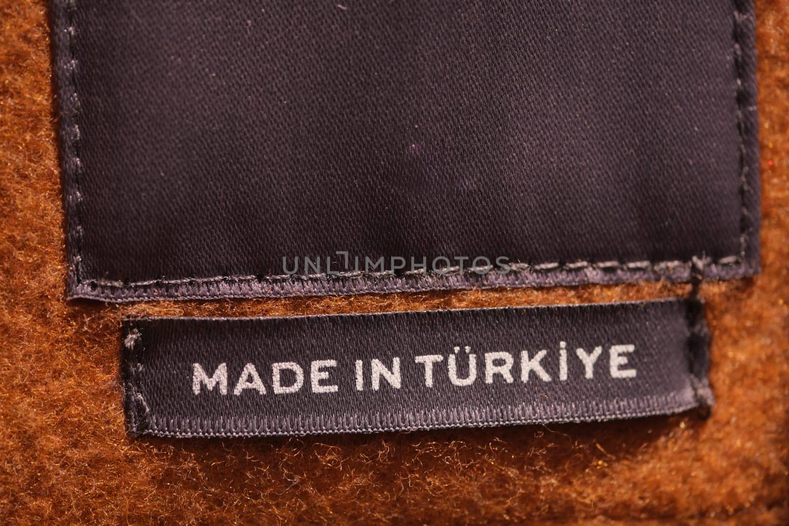 Close-up of a fabric label indicating the place of origin, Turkiye.
