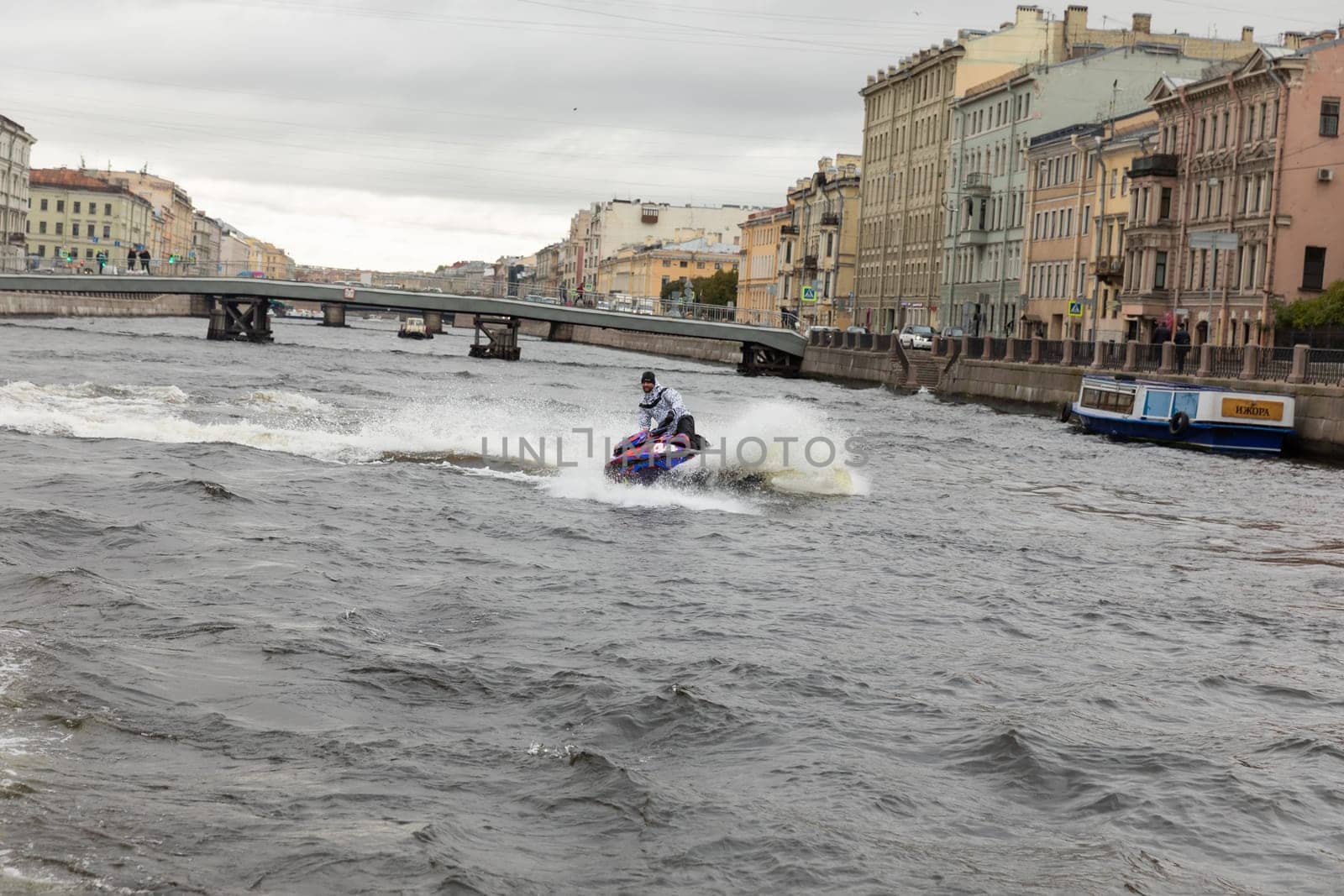 St. Petersburg, Russia, 16 October 2024, Neva River, Man Riding a Jet Ski