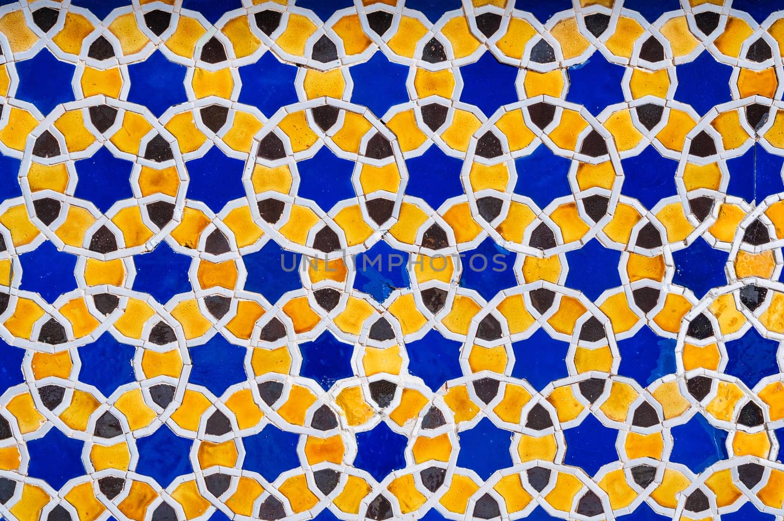 yellow and blue ceramic tiles with an abstract geometric pattern. Background with oriental arabic ornament