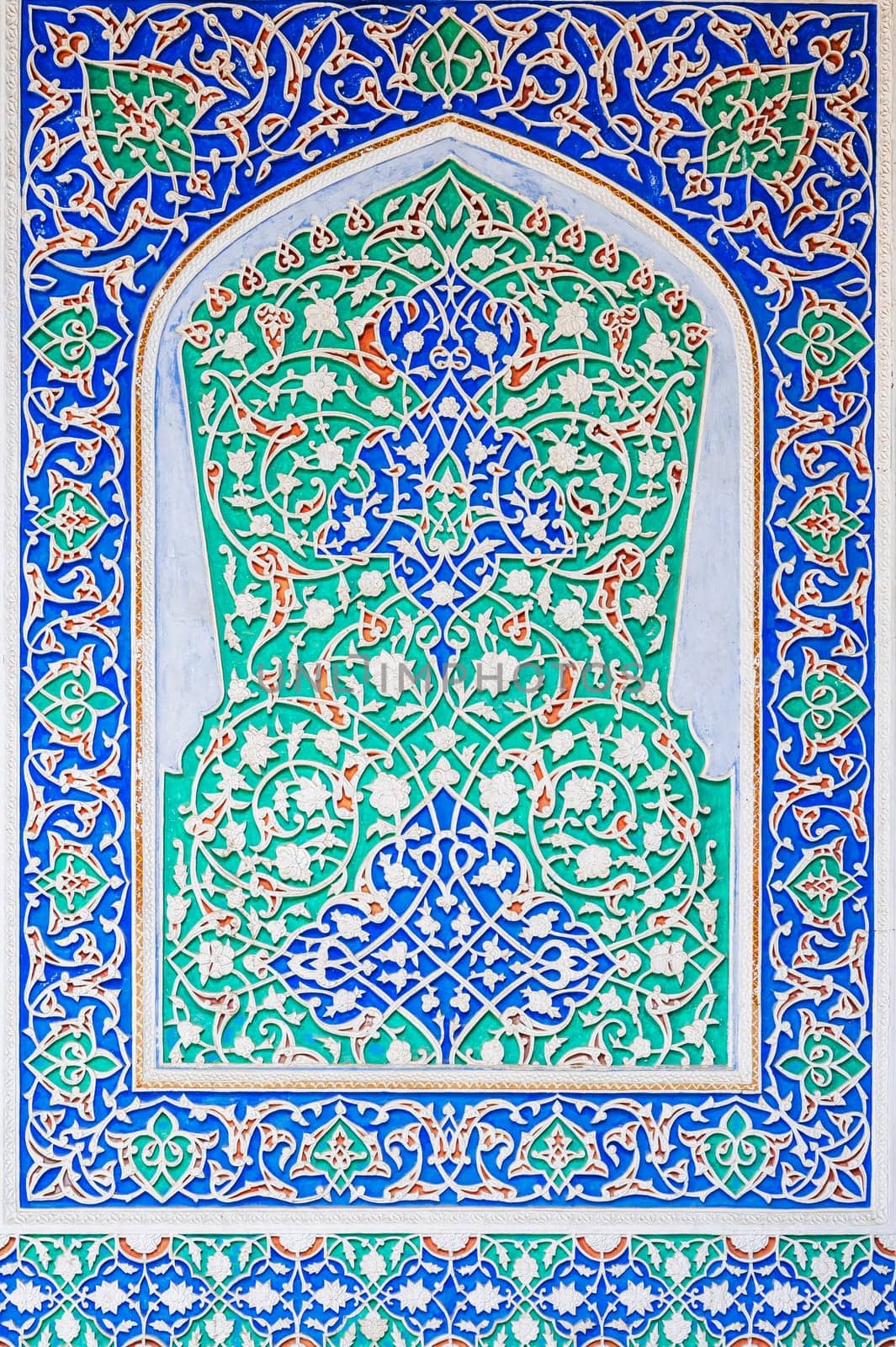 painted carved wooden background with traditional Uzbek ornaments and colorful oriental patterns in Tashkent in Uzbekistan