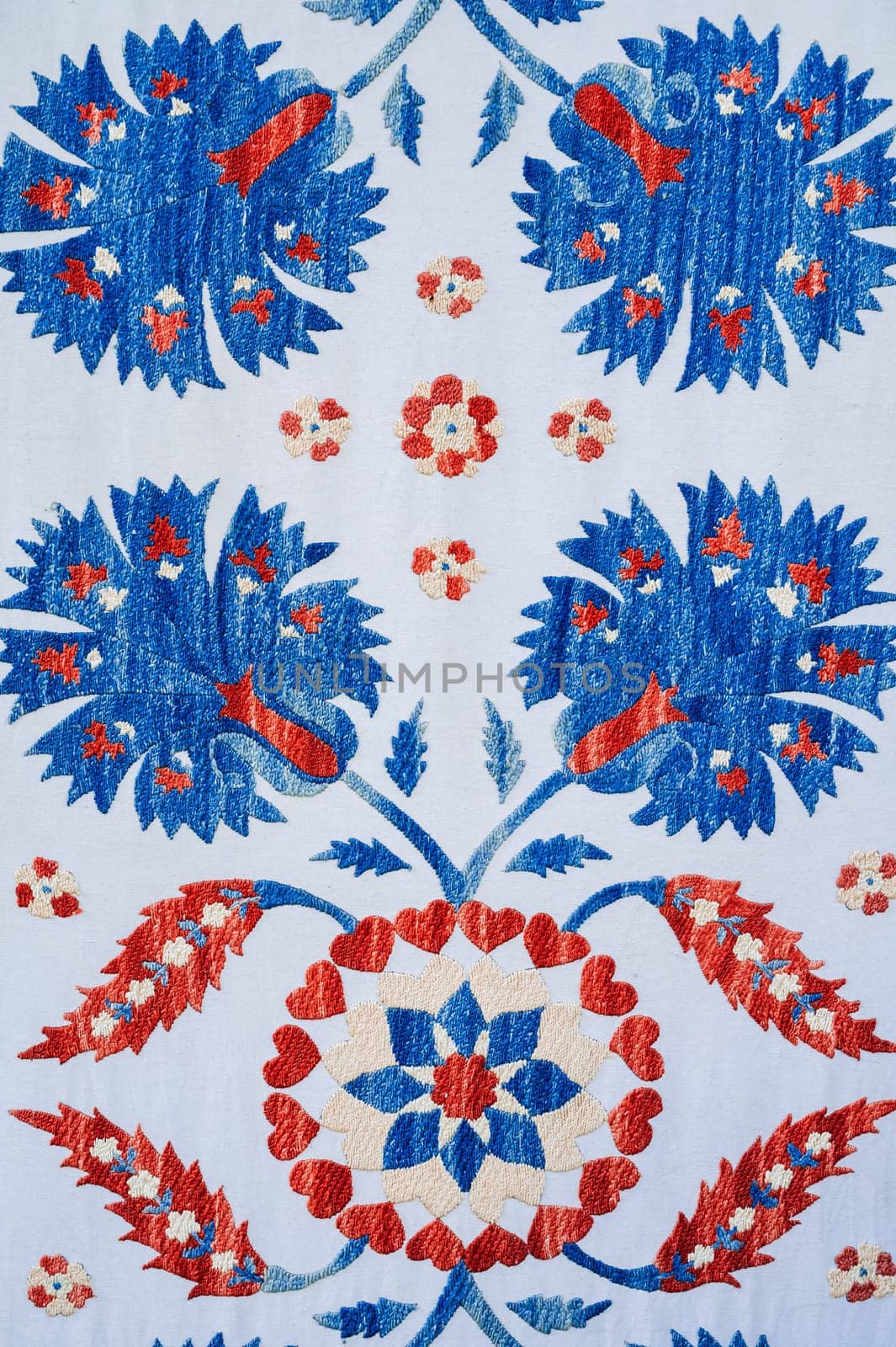 traditional Uzbek geometric pattern on an ancient carpet in Uzbekistan. Oriental white background with beautiful ornaments