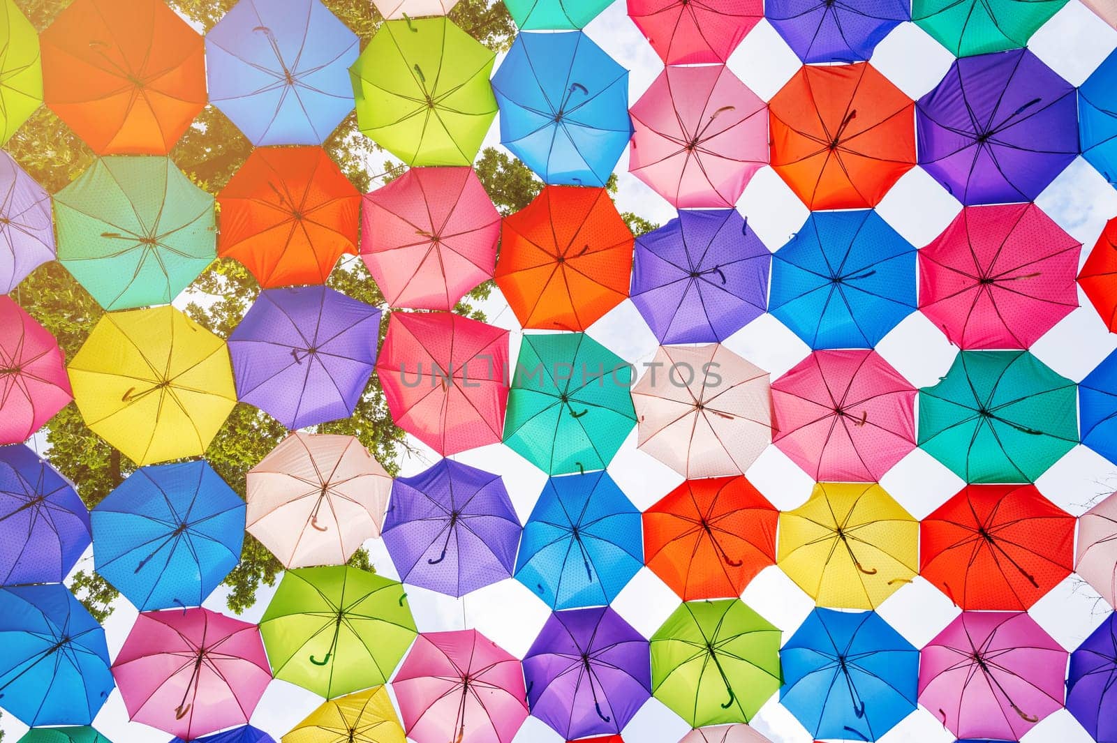 multicolored bright colorful umbrellas decoration on festive street on Magic City Park in Tashkent