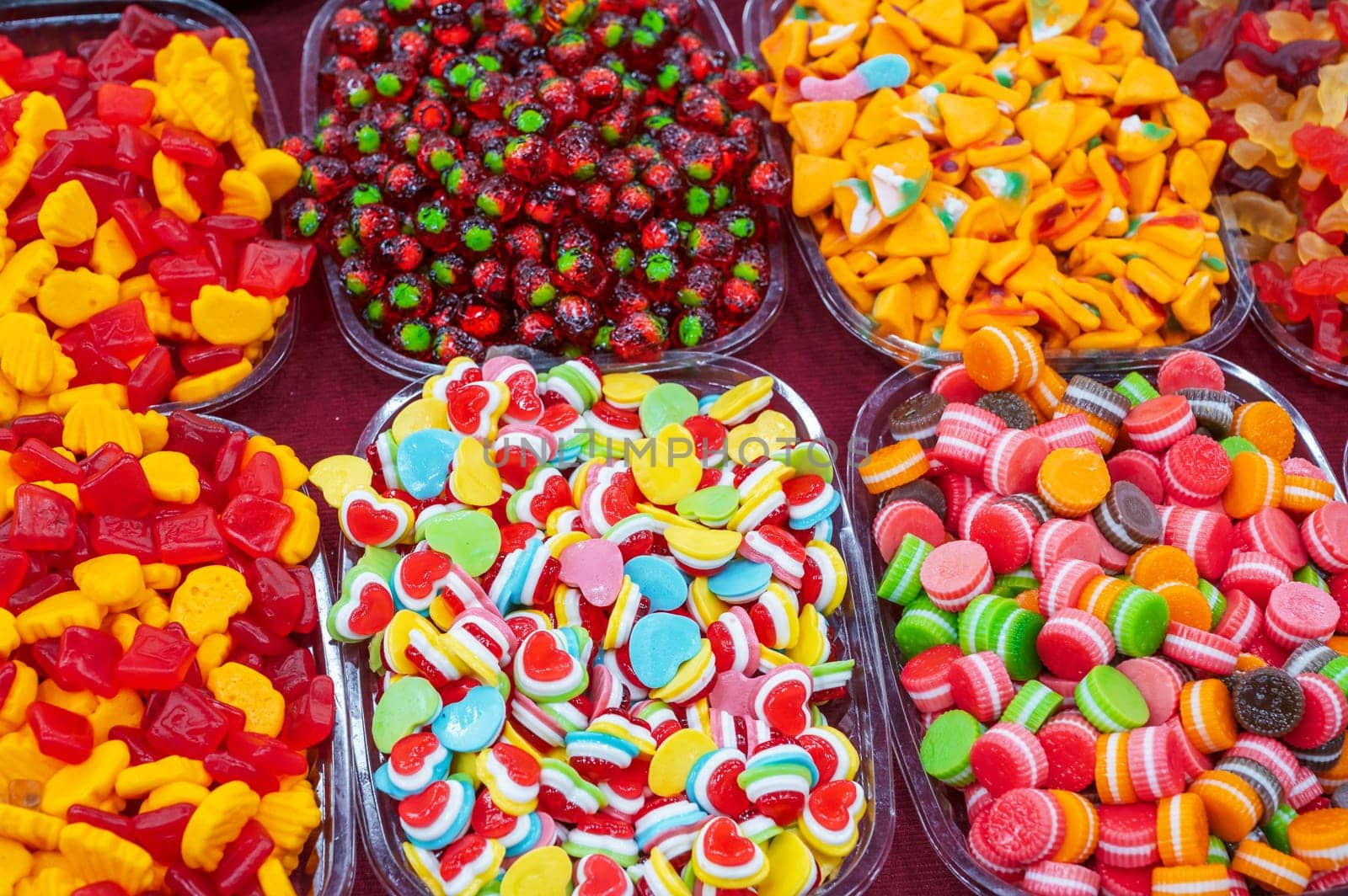 colorful marmalade and chewable candies on counter at a candy store in the oriental market