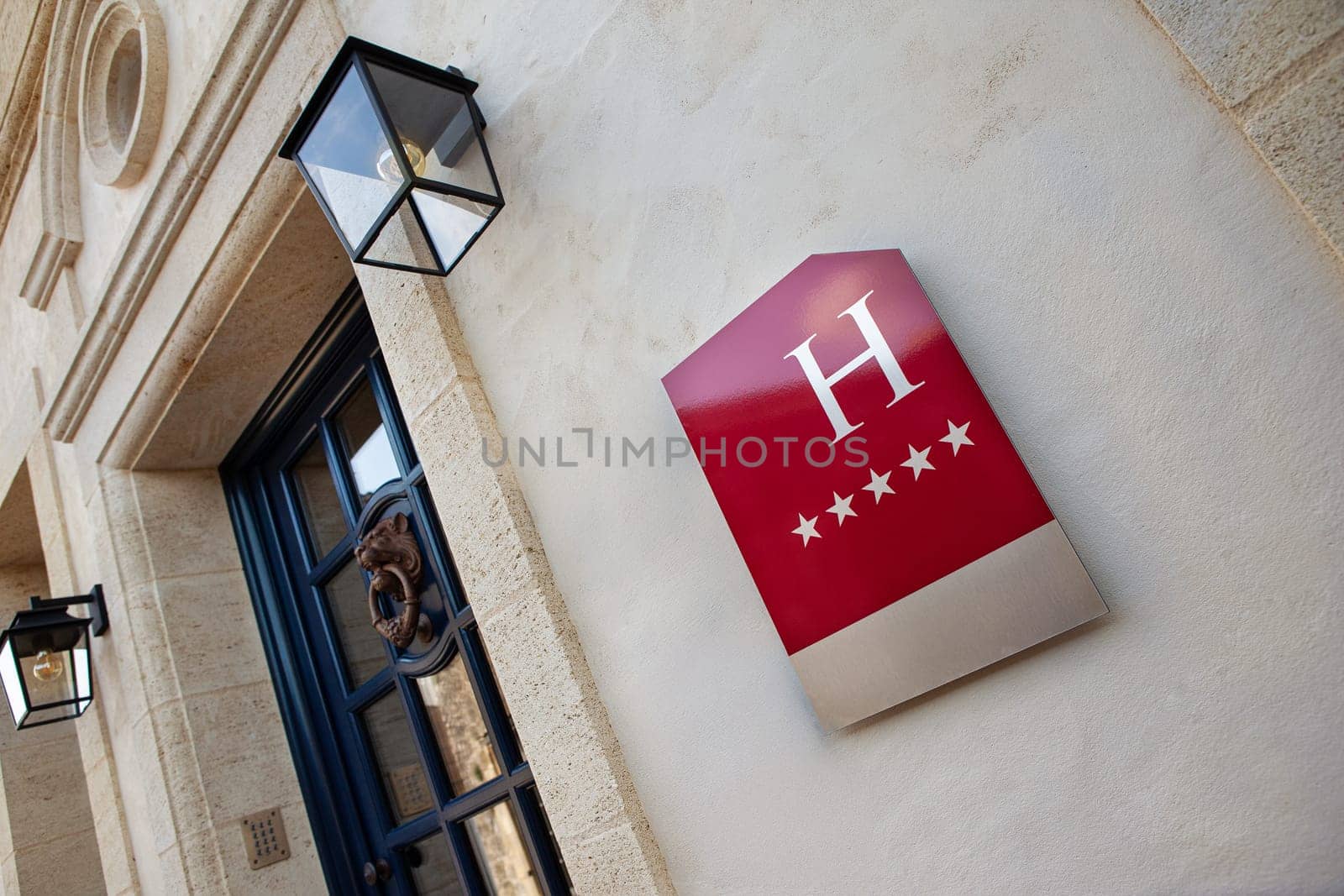 Five stars hotel sign on a facade