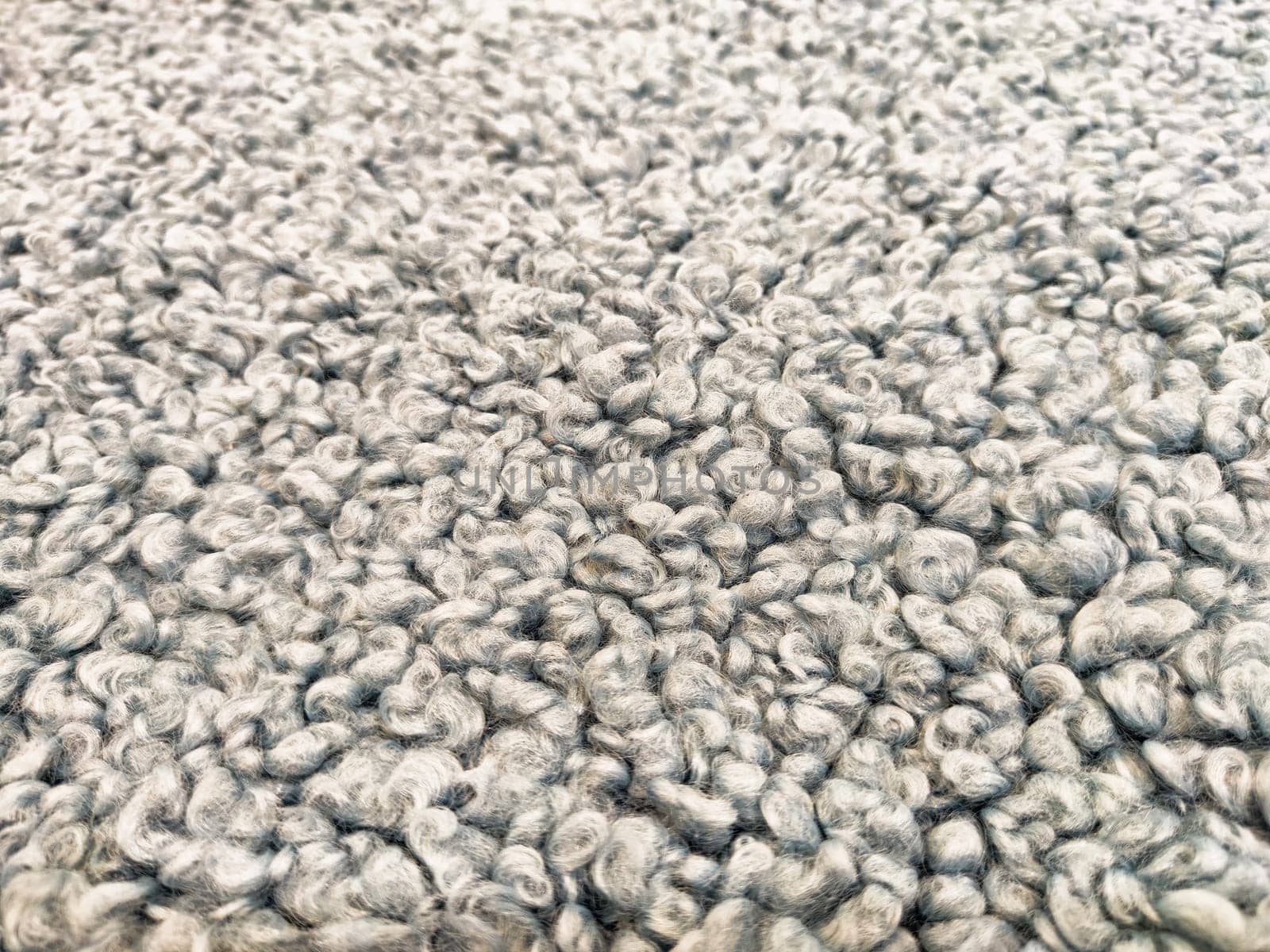 Close-up view of a soft, textured carpet showcasing a unique pattern, suited for warmth and style in home and office environments.