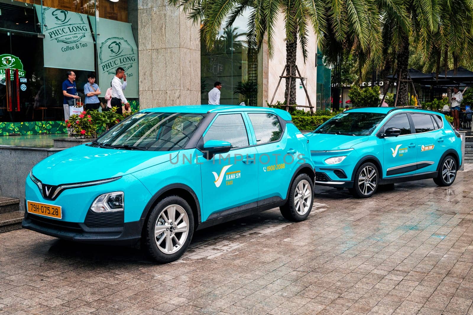Blue Vietnamese electric cars Vinfast taxi on the street in Vietnam. Nha Trang, Vietnam - April 01, 2025