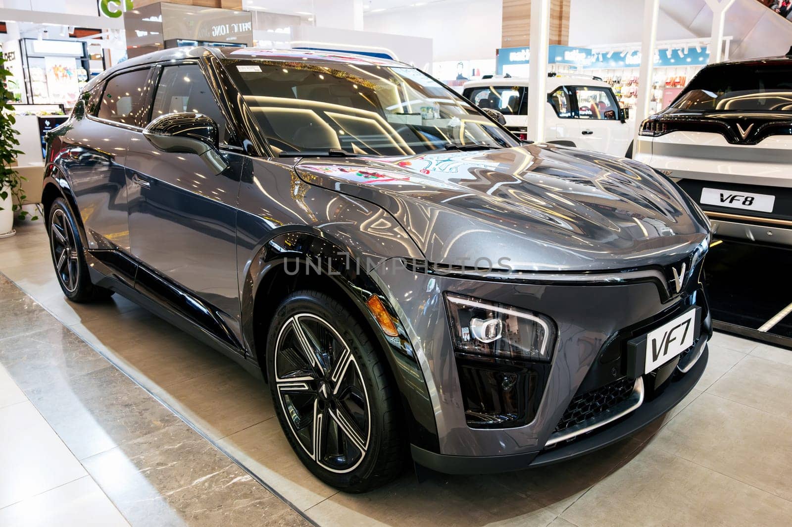 Modern Vietnamese electric car Vinfast VF7 at the automobile exhibition Vingroup expo in Vietnam. Nha Trang, Vietnam - April 01, 2025