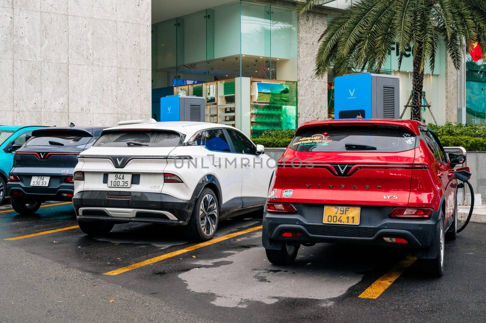 Vietnamese electric cars Vinfast at charging station on street in Vietnam. Nha Trang, Vietnam - April 01, 2025