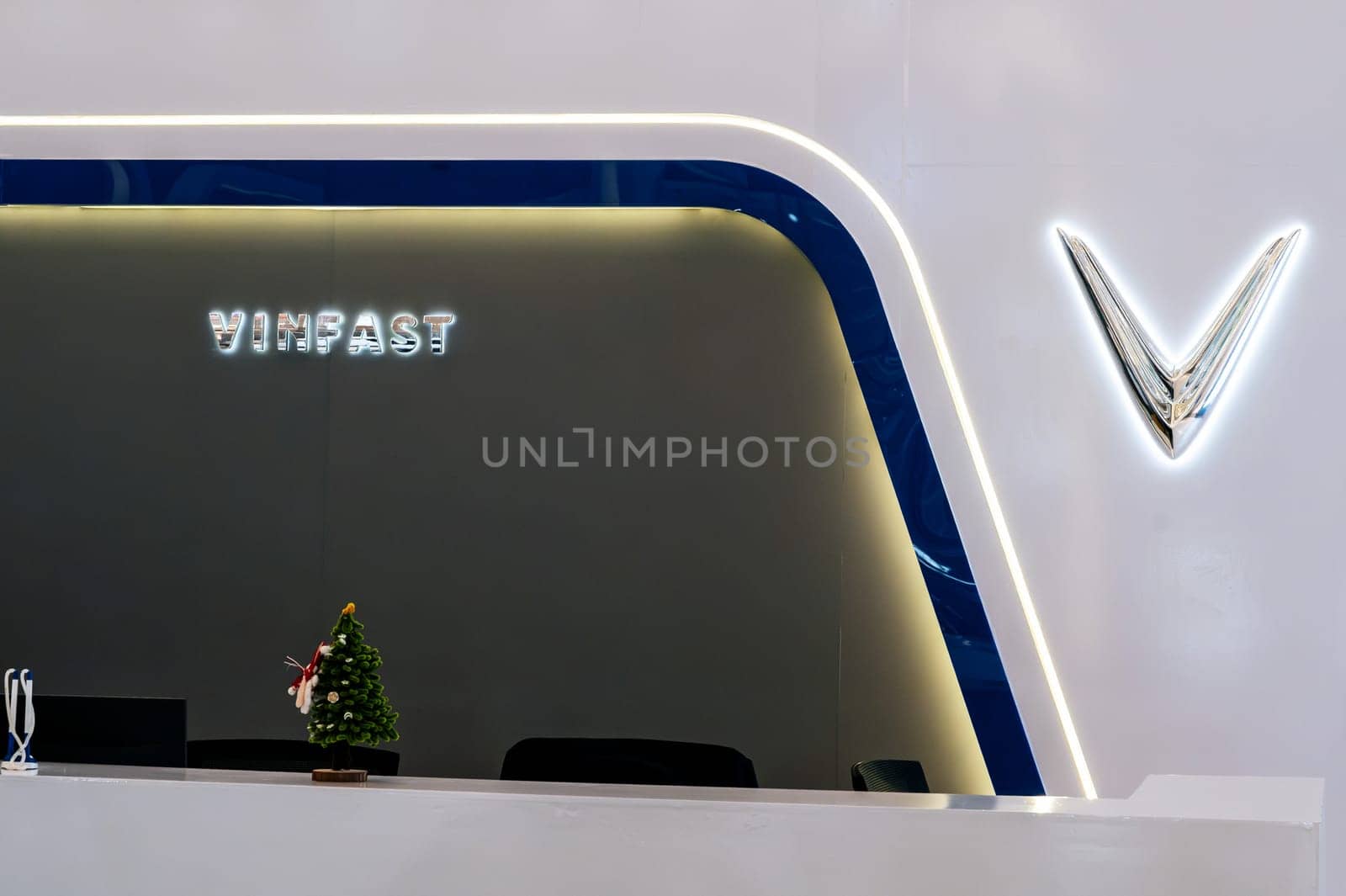 Logo of Vietnamese brand of Vinfast electric cars manufactured by Vingroup at automobile exhibition in Vietnam. Nha Trang, Vietnam - April 01, 2025
