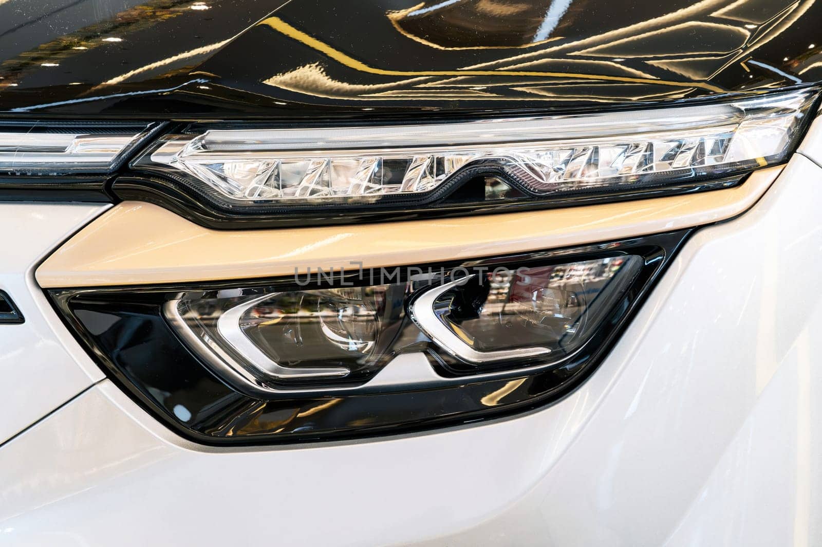 front headlight on hood of luxury modern Vietnamese electric car close-up