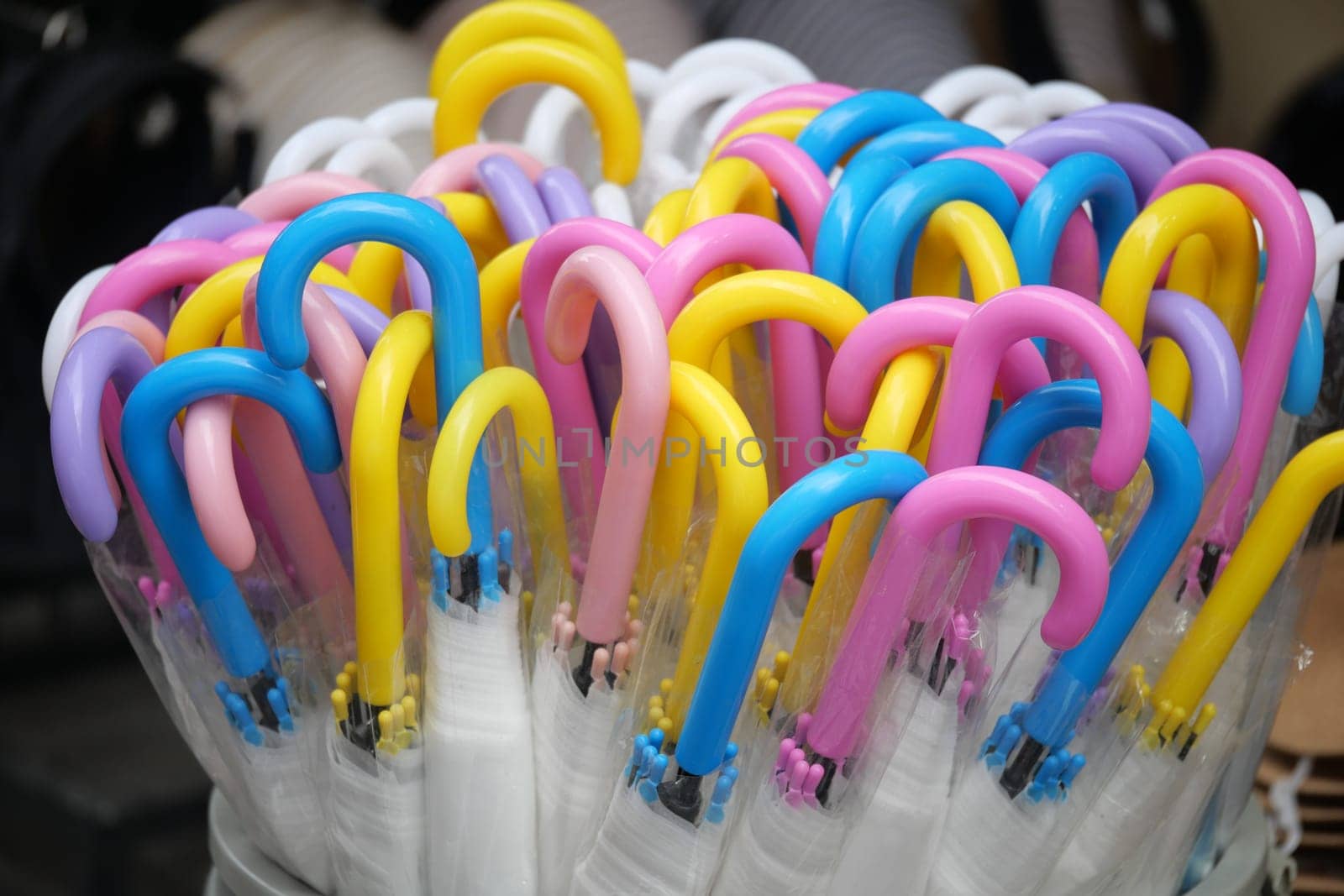 Brightly colored umbrellas showcase their unique designs in a market.