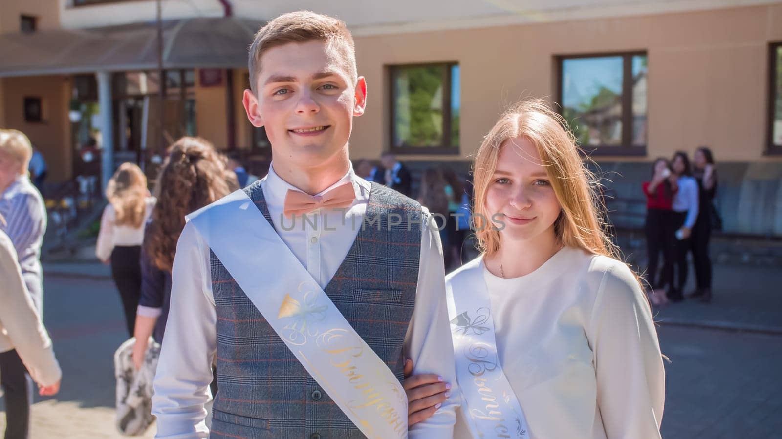 Russian schoolchildren graduates posing on the day of graduation