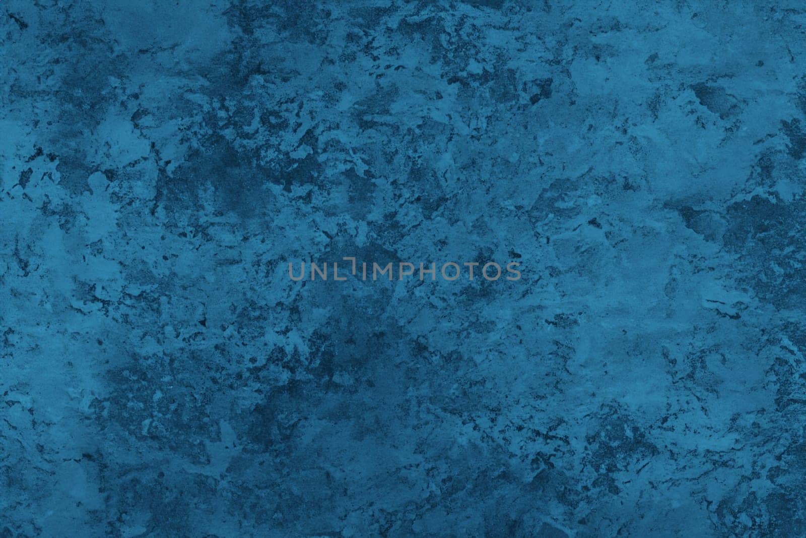 Abstract decorative dark blue plaster wall background