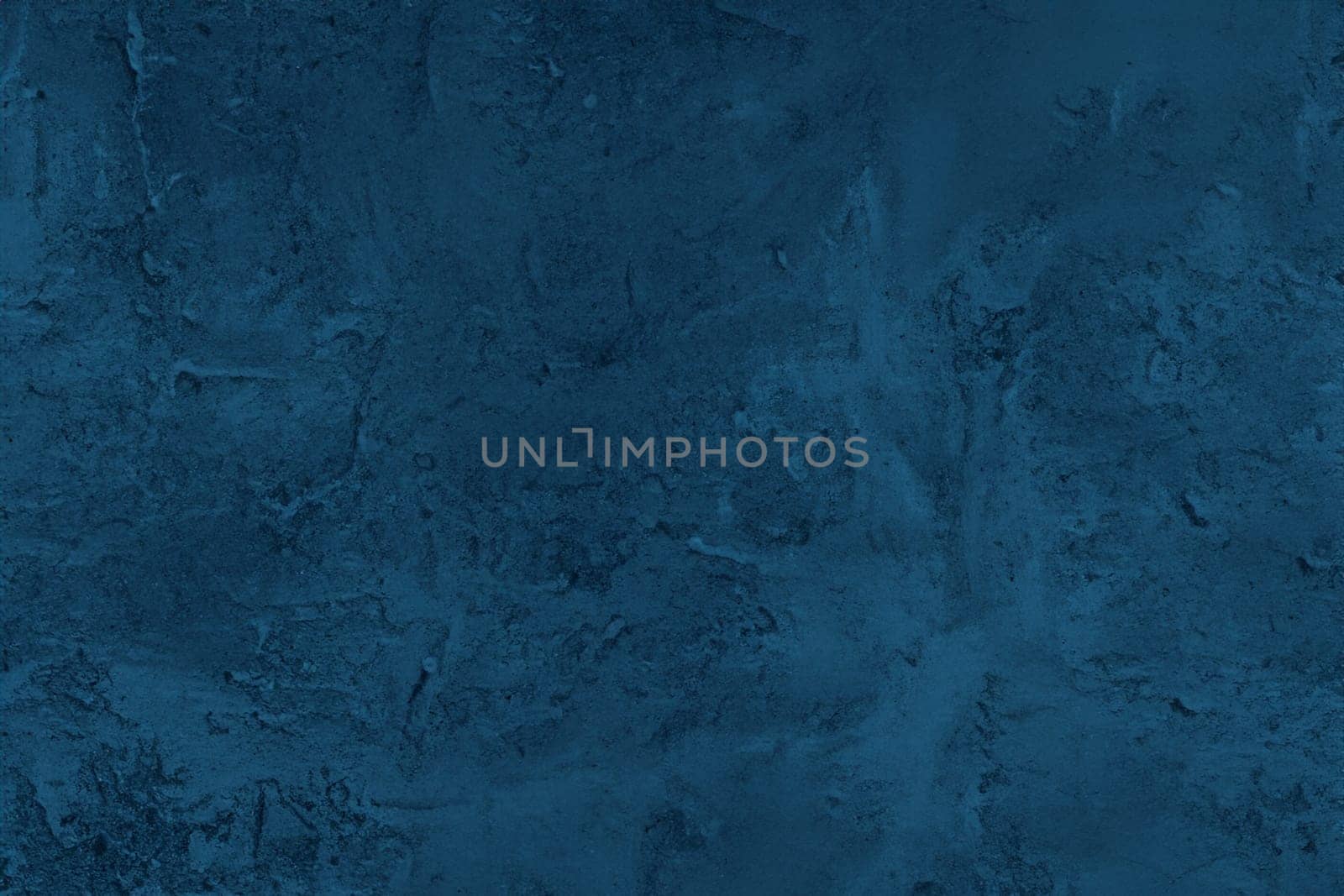 Abstract decorative dark blue plaster wall background