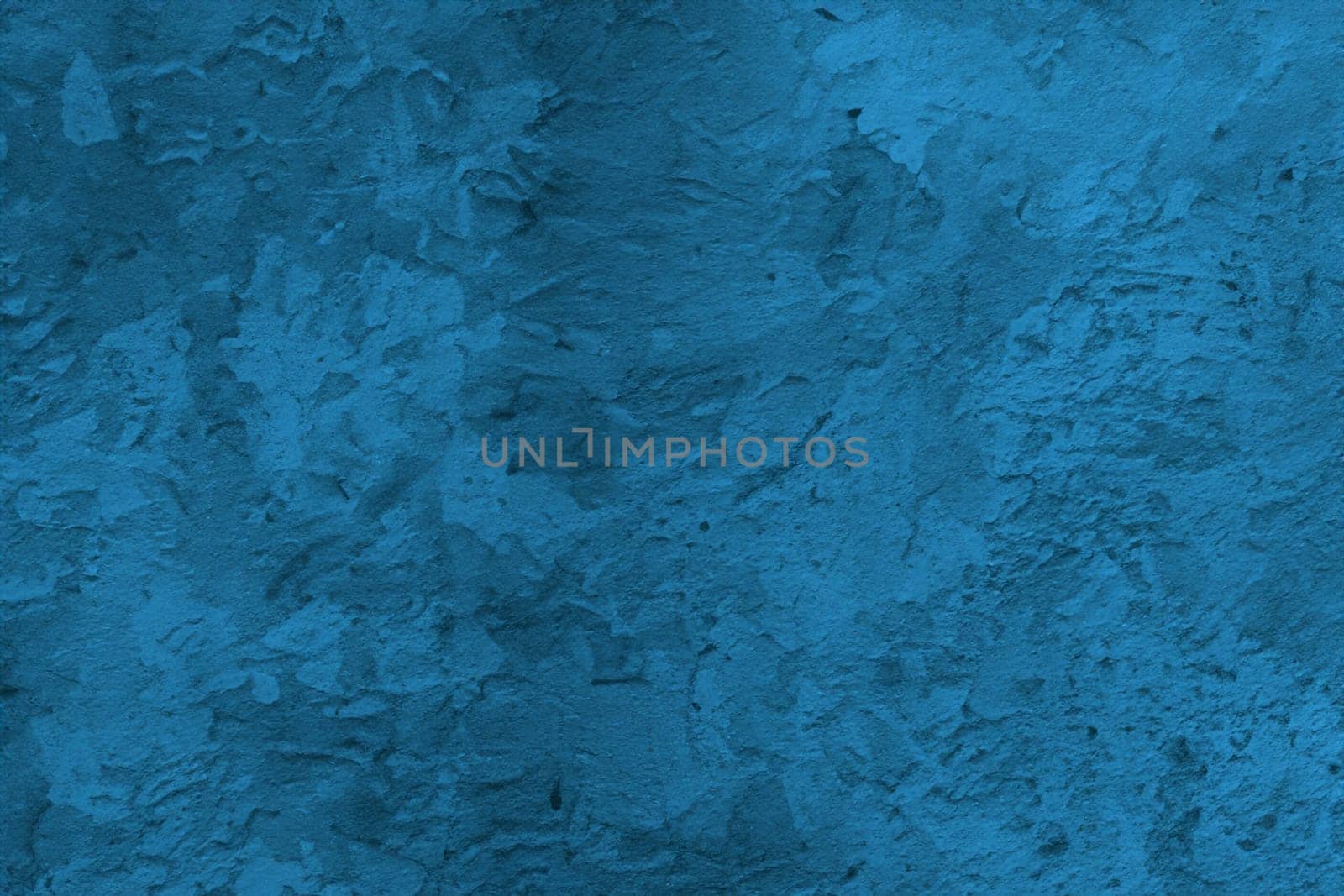 Abstract decorative dark blue plaster wall background