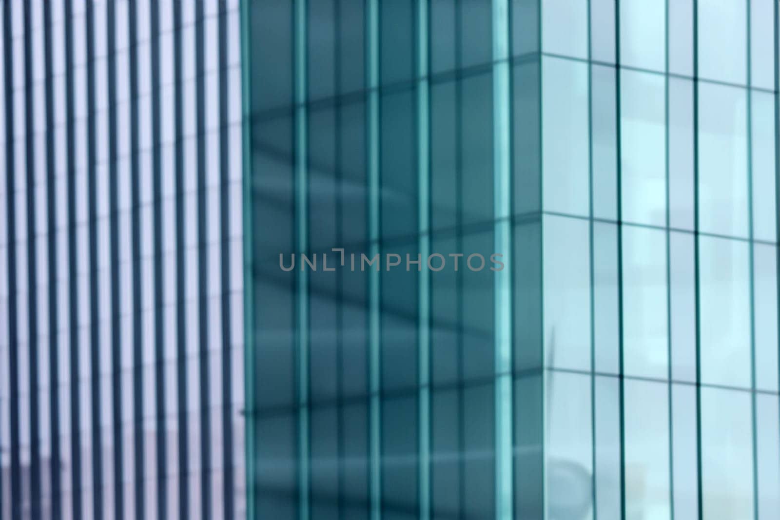 blurred abstract grey glass wall from building background. abstract architectural theme