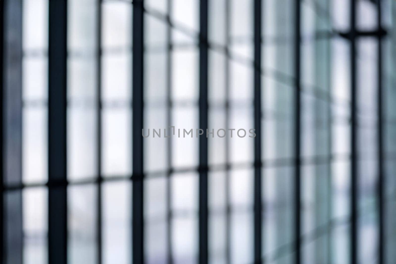 blurred abstract grey glass wall from building background. abstract architectural theme