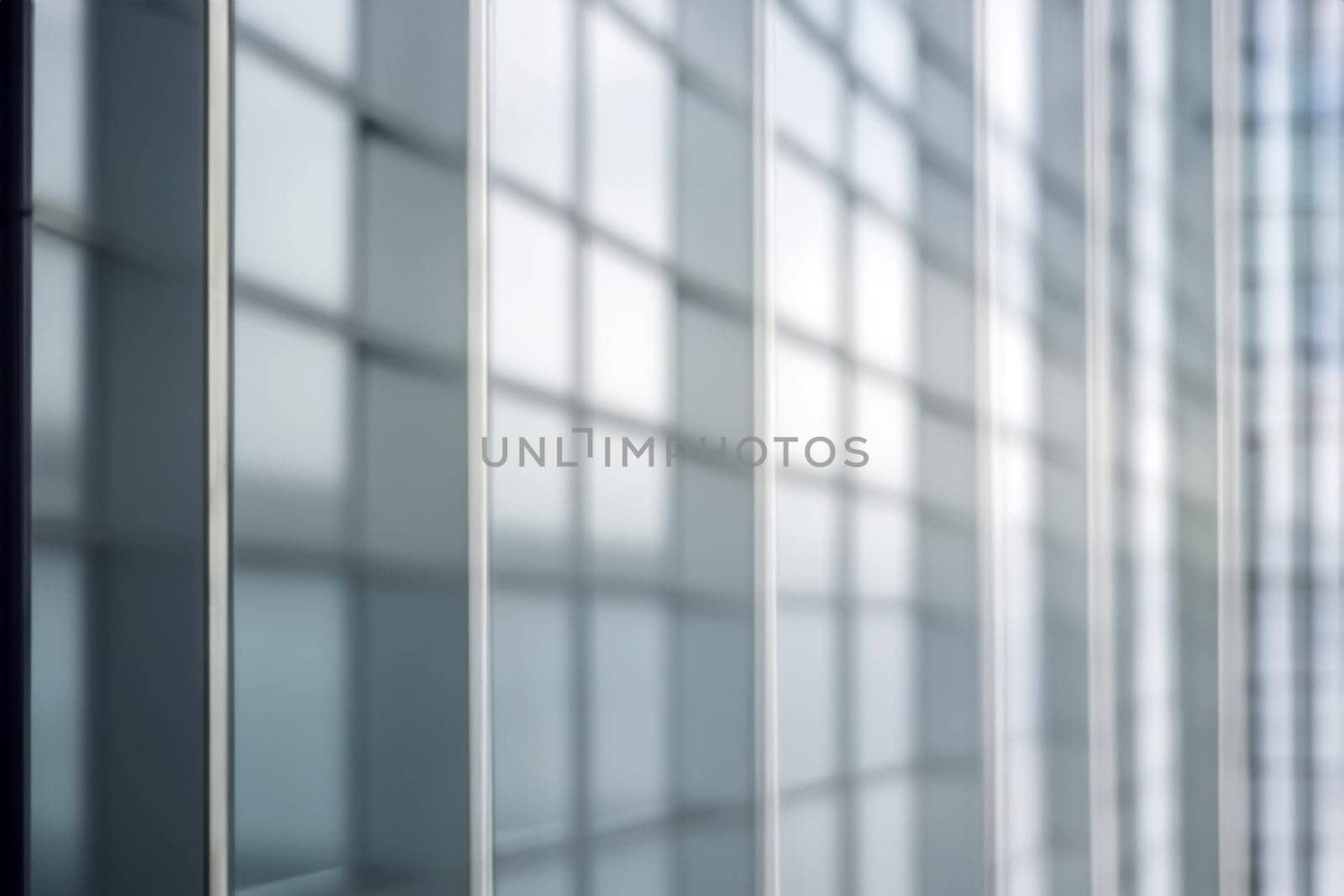 blurred abstract grey glass wall from building background. abstract architectural theme