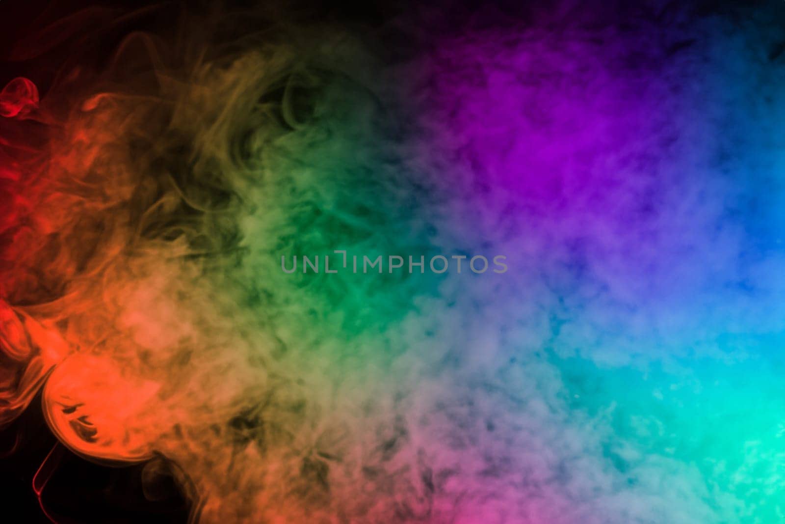 colorful smoke on dark background. artistic colorful background